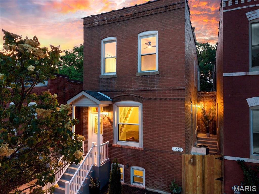 Welcome home to this beautifully renovated Tower Grove East gem, updated, spacious, and truly move-in ready. Every detail has been thoughtfully designed to blend modern comfort with the charm of St. Louis City living. Step inside to an open, airy floorplan featuring high ceilings, recessed lighting, luxury vinyl plank flooring, special millwork, and an exposed brick accent wall that adds warmth and character. The stunning eat-in kitchen is a showstopper with custom cabinetry, crown moldings, leathered granite counters and backsplash, undermount sink, island, brand-new appliances including electric range, dishwasher, microwave, and refrigerator. The adjoining dining room offers the perfect space for gatherings and everyday living. With 3 bedrooms and 3 FULL bathrooms, this home provides flexibility for guests, work-from-home needs, or a growing household. The full walk-up basement extends your living space with carpet tiles and plenty of room for storage, hobbies, or future finishing. Enjoy cozy evenings by the electric fireplace, morning coffee on the deck, and a level, fenced yard ideal for pets or play. A rare detached garport in the alley adds convenience and protection from the elements, with a brand-new sidewalk leading to your deck and rear entrance. Fully fenced, private back yard. Located in the vibrant Tower Grove East neighborhood and close to Tower Grove Park, local restaurants, shops, and all the energy of city life, this home offers the perfect blend of style, comfort, and location. Totally rehabbed. Completely refreshed. Ready for you today! Garage door and opener has been installed!!!  Enjoy the convenience and privacy of your very own garport!!!