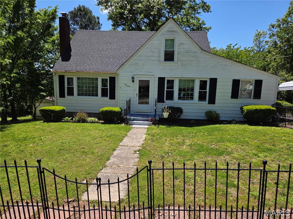 Charming cottage style home full of character and timeless appeal! From the beautiful staircase and arched doorway to the original wood doors with original door knobs complete with skeleton keyholes, this home is packed wth charm galore! Warm wood floors, natural light, solid wood front door and cozy living spaces create an inviting feeling throughout. The kitchen features stainless appliances, wood cabinets and a pantry for added storage.  Offering 3-4 bedrooms, 1.5 bathrooms, this home also includes a full unfinished walk-out basement with endless potential. Enjoy outdoor living on the deck overlooking the large backyard-perfect for a pool, playground, yard games or entertaining. This property offers an additional 200x100 lot for added yard space & privacy. Property features include, newer roof, carport, detached garage, shed, raised garden beds,and a wrought iron fenced front yard enhancing the charm. Additional updates include tilt in windows and a new breaker box. Conveniently located in town but minutes from the Meremec River! This property would make a beautiful residence, weekend get-a-way, or an ideal Airbnb opportunity. Schedule your private showing today!