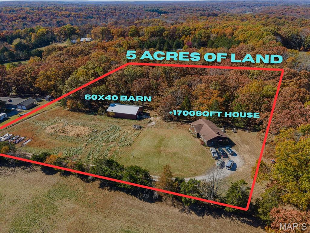 This ranch-style home offers over 1,700 square feet of living space and sits on nearly 5 acres of land, creating the perfect canvas for someone looking to escape city life and enjoy space, nature, and privacy. The front portion of the property is flat and usable, while the rear is surrounded by beautiful mature trees and woods, offering a serene backdrop and natural seclusion.

A major highlight of the property is the newer 60x40 pole barn, providing endless possibilities. Ideal uses include RV or boat storage, a workshop, man cave, storage for work equipment, or even space for farm animals — the flexibility here is hard to find.

The home itself is a handyman special with solid bones, ready for the next owner to bring their vision to life and customize it to their liking. With the amount of land, setting, and structure already in place, this is a great chance to create instant equity and long-term generational wealth through thoughtful updates.

Located in the Hillsboro School District, the property also benefits from everything Cedar Hill has to offer. Cedar Hill Park provides easy access to the Big River for fishing, canoeing, picnicking, and enjoying the outdoors. The area is known for its close-knit, family-oriented community, where neighbors know each other and life moves at a more relaxed pace. With low traffic and a strong sense of safety, it’s an ideal setting for those who value peace, quiet, and room to breathe.

Whether you’re looking for acreage, privacy, a place to build sweat equity, or a long-term homestead, 7551 Washout Dr offers a rare blend of land, structure, and opportunity that doesn’t come along often.