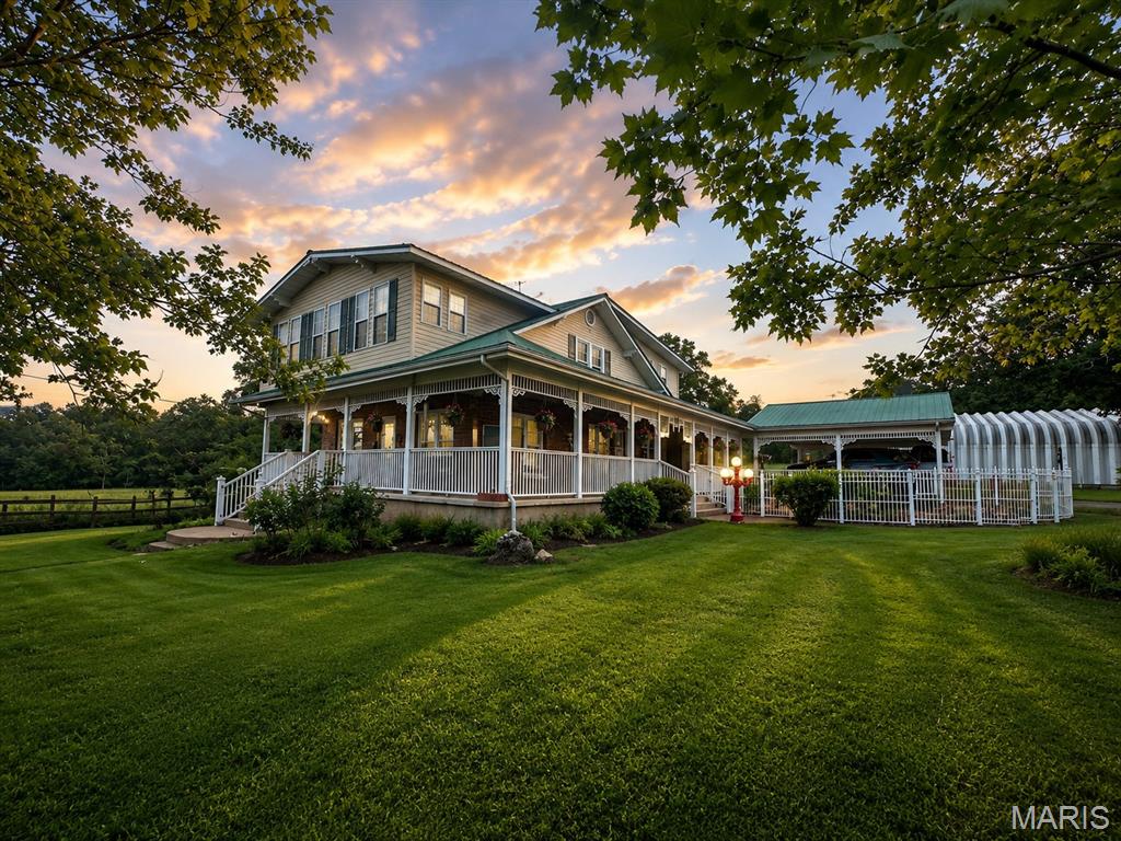 59 +/- acre farm in beautiful Belleview, Missouri featuring an exceptional Craftsman-style granite home with quality craftsmanship and tasteful updates throughout. This versatile property offers approximately 16 acres of pasture, some fencing, a small pond, two wells, and breathtaking views of Buford Mountain. The spacious home includes 3-4 bedrooms, 2 full bathrooms, walk-in closets, and two kitchens, making it ideal for multi-generational living, guests, or entertaining. The full unfinished basement provides room for additional storage. Relax and enjoy the scenery from the terrace deck off the master bedroom, rear patio, or charming covered wrap-around porch spanning two sides of the home. A distinctive cupola adds character and curb appeal. Property also includes a large barn, attached carport, detached 2 car garage, several outbuildings, and a 48x30 Quonset building. The Quonset features a 15x30 heated and cooled crafting area complete with restroom, while the remaining space serves as a large workshop perfect for hobbies, equipment, or business use. A rare opportunity to own a scenic and functional farm property with gorgeous views, versatile amenities, and room to grow.