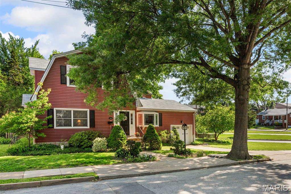 Lovingly maintained and available for the first time in over 60 years, this charming 1.5-story Cape Cod offers 1,800+ sq ft of comfortable living on a spacious corner lot framed by mature foliage — the beautifully tended yard of a seasoned gardener. The thoughtful main floor layout features two separate living areas, a stunning brick fireplace, and a kitchen that opens to the dining/family room, complete with a sunlit breakfast nook adorned with bay windows. A main floor bedroom and full bath add convenience, while three additional bedrooms and a second full bath are tucked upstairs. Step outside to a generous deck overlooking the fabulous backyard, and take advantage of the walk-out basement for ample storage. A 1-car garage, new furnace, and some newer appliances round out the package. Located in the sought-after Brentwood School District with a walkable route to the elementary school, and situated right along the Great Rivers Greenway. Home to be sold in "as is" condition, including the Brentwood Occupancy inspection.