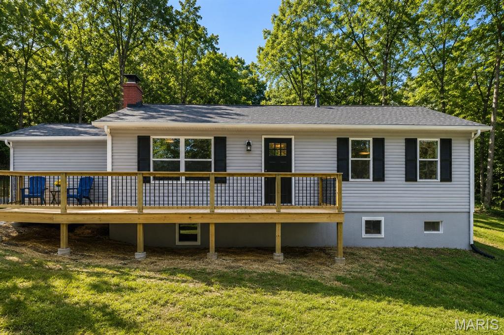 This home truly needs to be experienced in person to appreciate everything it has to offer. Schedule your private showing today—you may be pleasantly surprised, and all reasonable offers will be thoughtfully considered. Completely renovated and thoughtfully reimagined, this 4-bedroom, 3-bath home in De Soto offers the rare opportunity to own a property where nearly everything is new. This is a true restoration—not a surface-level update—completed with a high level of care and attention to detail throughout.

Originally a 3 bed / 2 bath, the home has been expanded to a functional 4 bed / 3 bath layout, including a finished lower level with an added bedroom, full bath, and additional living space. An egress window was installed in the basement despite existing walk-up access, adding both safety and flexibility.

The kitchen has been completely redone with granite countertops, stainless steel appliances, and top-end custom cabinetry, along with new flooring throughout the home. The former laundry area has been converted into a full bathroom/laundry combo for improved functionality.

Major improvements include new siding, roof, HVAC, drain tile around the foundation, and connection to public sewer with a private well, providing peace of mind that the important systems have been addressed.

Outside, a substantial 750 sq ft wraparound deck extends from the front to the back of the home, including a covered rear patio entrance, creating a standout outdoor living space.

Situated on a generous lot, this home offers space, quality, and a level of renovation that is hard to find. Completed as if it were being kept long-term, this is a true move-in ready opportunity.