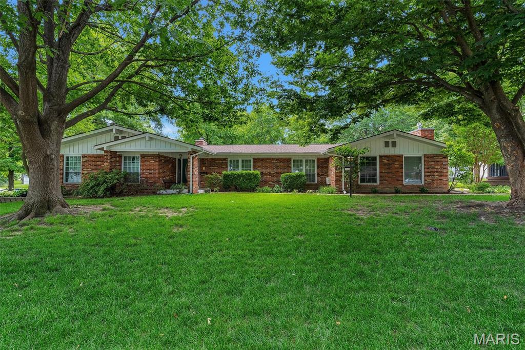 Looking for main-level living in Kirkwood? This spacious 5-bedroom, 3-bath ranch offers comfort, convenience and plenty of room to spread out. Situated on a corner lot of over half an acre, this home features an attached 2-car garage, a functional floor plan, and multiple living spaces designed for everyday living and entertaining.
Step inside to a welcoming living room that flows seamlessly into the cozy family room with a fireplace. Just off the family room, you'll find a full bath and one of the five bedrooms, making it an ideal space for a home office or guest suite. The main-floor laundry room is conveniently located just off the attached 2 car garage.
The eat-in kitchen offers abundant cabinet and counter space, while the spacious dining room, complete with a second fireplace, is perfect for hosting family gatherings and overlooks the level backyard. Down the hall are three generously sized bedrooms, a full hall bath and the private primary suite featuring a full bathroom and walk-in closet.
The partially finished lower level adds even more living space with a wet bar, making it the perfect place for entertaining or relaxing. A large unfinished area provides endless possibilities for storage, a workshop, home gym, or hobby space. Step outside to enjoy the fully fenced backyard and expansive patio, ideal for entertaining, outdoor dining, or simply unwinding. Conveniently located within walking distance of Kirkwood schools, parks, shopping, and restaurants, this home offers the perfect combination of space, location, and lifestyle. Schedule your private showing today!