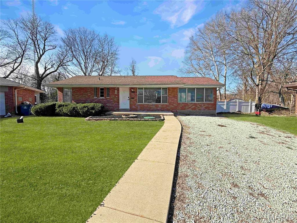 Tucked away at the end of a quiet street, this well-kept brick ranch offers a comfortable layout with room to spread out. Inside, you’ll find two bedrooms and a full bathroom on the main level, along with a bright living space filled with natural light. The separate dining room features luxury vinyl plank flooring and plenty of sunlight, perfect for everyday meals or hosting. Just off the main living area, the sunroom adds flexible space for relaxing, entertaining, or hobbies. The kitchen is thoughtfully laid out with ample counter space, making it both functional and easy to work in. Downstairs, the partially finished basement provides additional living space, a 2nd full bathroom, ideal for guests, a rec area, or a private retreat, plus convenient laundry. Large windows throughout the home bring in great light and offer peaceful views of the surrounding greenery. With shopping and dining just minutes away, this home blends quiet living with everyday convenience. Welcome Home!