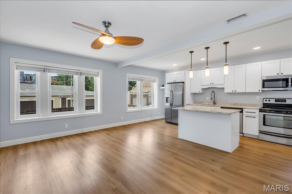 Discover this beautifully renovated end-unit condo where classic old-world charm blends seamlessly with a modern open floor plan. This bright and spacious 2-bedroom, 2-bath home offers comfortable city living in an unbeatable location.
The inviting great room features a ceiling fan and flows effortlessly into the updated kitchen, creating a wonderful space for both relaxing and entertaining. The kitchen shines with granite countertops, a large center island with built-in storage, stainless steel appliances (including refrigerator), and warm laminate flooring that extends throughout the main living areas.
Both bedrooms are generously sized with newer carpet and ceiling fans with lights. The master suite offers a walk-in closet and a private en-suite bathroom with a double bowl vanity and tub/shower combination. The second full bath is conveniently located in the hall and includes the in-unit washer and dryer. Both bathrooms feature durable ceramic tile flooring.  This unit is able to be rented.  At this price it makes a great investment property in an ideal location.
Additional highlights include fresh paint throughout, window blinds, a locked basement storage area, and a private rear patio. You’ll also enjoy the convenience of an enclosed, 1-car parking space.
Perfectly situated on a beautiful tree-lined street, this condo is ideally located between Saint Louis University Campus, the Cortex innovation district, and the BJC/Washington University Medical School campus — offering easy access to work, dining, and entertainment.