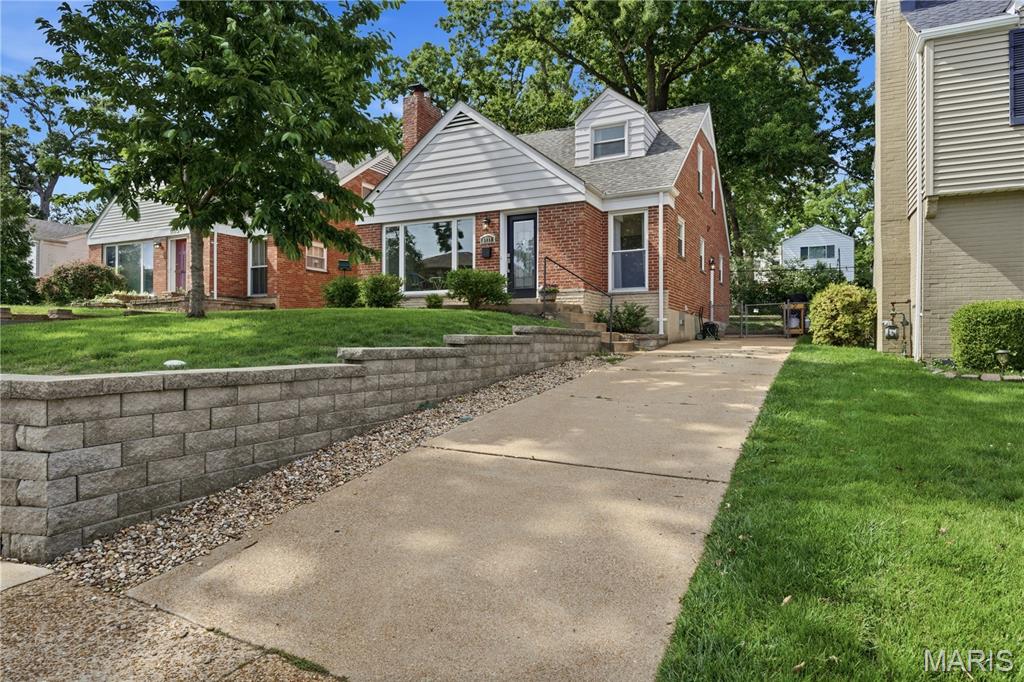 Welcome home to this charming and inviting Brentwood gem, where exceptional curb appeal and meticulous maintenance set the tone from the moment you arrive. Featuring a new architectural shingle roof (2024) and a comprehensive renovation completed in 2019, this home beautifully blends timeless character with modern updates. The thoughtfully updated kitchen offers 42" cabinetry, granite countertops, a Travertine tile backsplash, and stainless/black appliances. Hardwood floors span the main and upper levels, complemented by updated lighting, interior doors, trim, paint, thermal windows, and more. Major system improvements completed during the 2019 renovation include HVAC, and plumbing stack. The flexible upper level presents a unique opportunity to create an expansive primary suite, with one room serving as the bedroom and the adjoining room functioning as a spacious dressing room or dream walk-in closet. The dry, finished lower level adds incredible versatility with a rec room, office/sleeping area, generous laundry room, additional storage space, and a full bath—providing exceptional bonus living space for guests, work, or recreation.
Additional highlights include a stone fireplace, fenced backyard, and an unbeatable location in the highly desirable Parkridge Subdivision. Situated directly across from Brentwood Middle and High Schools and just blocks from McGrath Elementary, you'll also enjoy easy access to Clayton, the Galleria, Highways 40 and 170, Tilles Park, shopping, dining, and more.