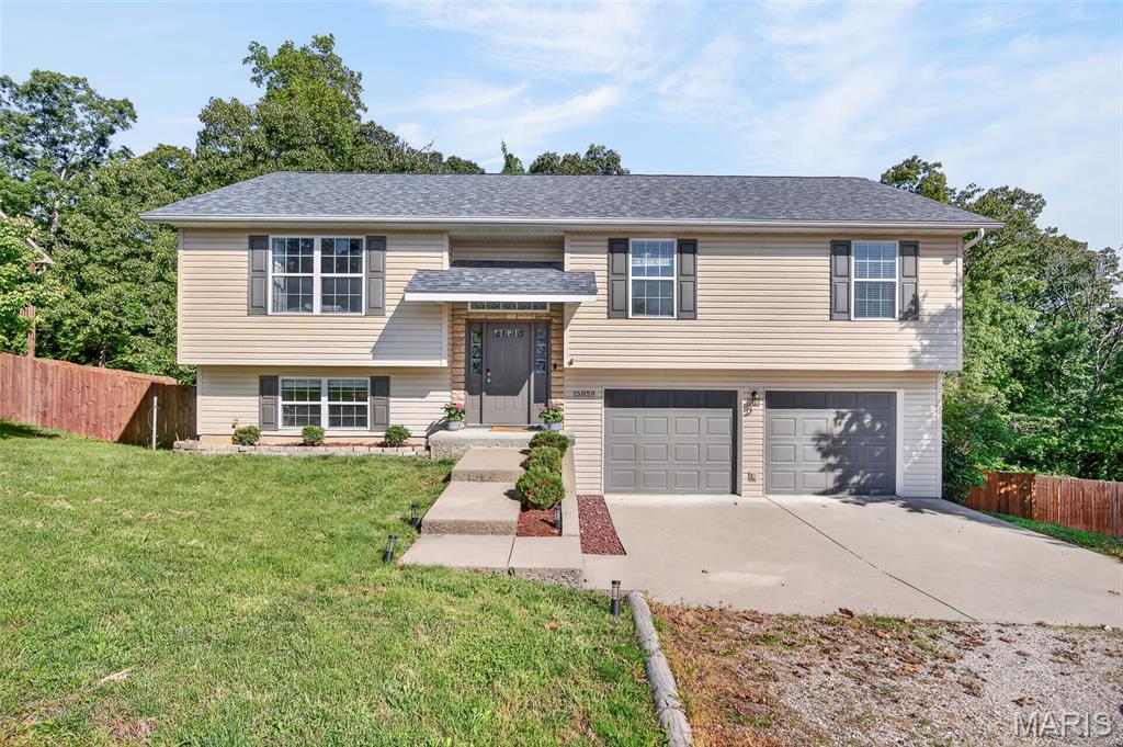 Nestled on a quiet street just minutes from Fort Leonard Wood, this beautifully updated 3 bedroom, 3 bathroom split-level home is priced to sell and ready for its next owners! From the moment you pull up, you’ll love the curb appeal, inviting feel, and super convenient central location. Inside, clean modern updates, fresh paint choices, and tons of natural light give the home a bright, open vibe that feels instantly welcoming.
The kitchen features stainless steel appliances and flows perfectly into the dining area, making everyday living and entertaining easy. Need space to spread out? You’ve got it. With TWO large living areas, there’s room for movie nights, game days, kids, guests, or simply escaping each other for a minute . One living area even features a built-in entertainment center with an electric fireplace that adds the perfect cozy touch.
Upstairs, all bedrooms offer generous space and storage, including a spacious primary suite with a large ensuite bathroom you’ll definitely appreciate. Outside, the oversized fenced backyard and deck are ready for summer BBQs, relaxing evenings, entertaining friends, or letting the dogs run wild.
This one checks all the boxes — updated, spacious, great location, and move-in ready. Don’t wait too long or someone else is gonna snag it first . Call today for your private showing!