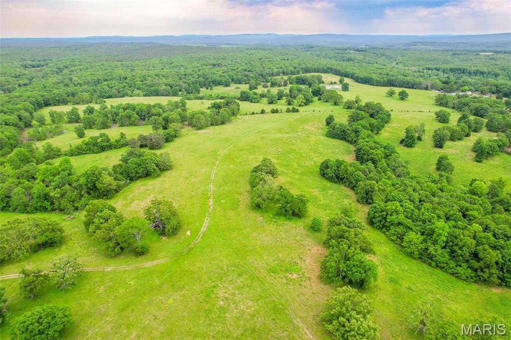 Generational type Family Farm!

Tucked away off a privately owned road in the rolling hills of Belgrade, Missouri, this outstanding 322-acre property offers the perfect blend of natural beauty, functionality, privacy, and recreation. Located just minutes from the historic town of Caledonia, this property is more than just a farm; it’s a once-in-a-generation opportunity to own a true legacy property.

The land itself is incredibly diverse and well-balanced, featuring beautiful rolling hills, open pasture, mature timber draws, and a peaceful live creek winding through the property. Four ponds are scattered throughout the farm, providing excellent water sources for livestock and wildlife. Perimeter and cross fencing are already in place, making this an ideal setup for a cattle operation or horse farm. 

Several incredible build sites offer breathtaking views and outstanding privacy. With electric and a well already established, the groundwork is in place for someone to create a true legacy property, whether that’s a private family retreat with multiple homes, a full-time residence, or the ultimate weekend escape.
For outdoor enthusiasts, this property is nothing short of exceptional. The mix of live water,  timber, and open ground provides outstanding habitat for deer and turkey. You could also plant crops, ride trails, fish the ponds, or take a short trip to Council Bluff Lake for more fishing and outdoor recreation. In addition, the Northwest corner of the property offers direct access to national forest. 

Whether you envision running cattle across the rolling pasture, building cabins for family and friends, or owning a secluded hunting paradise, this property has the versatility and character to make it happen. Properties of this size and magnitude are exceptionally hard to find — a true generational farm built to be treasured for decades to come.