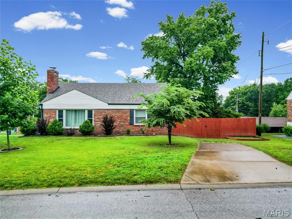 Welcome to Affton, and this move-in-ready brick home with 3 bedrooms and 2 full & modern baths is beautifully updated and maintained.  A large living room with a wood-burning fireplace, a huge picture window, and hardwood flooring is your entry.  The large dining room has hardwood floors and lots of natural light with a built-in china cabinet. There are 2 main bedrooms and a 3rd large bedroom in the lower level with its own bath.  The kitchen is updated with an electric range, an island for more storage, and newer appliances. There is also a large family room space with a separate entry. 
The lower level is finished with a recreation room, a full bath with a newer walk-in shower, subway tile, and glass shower doors. The updated high-energy HVAC system, energy-efficient water heater, and new electric panel. There is an attached one-car garage with a new insulated garage door & a Genie quiet opener. The level corner lot and extra driveways for off-street parking make it easy to entertain the whole family. This home is located in a fantastic area with quick access to entertainment, highways, dining, and much more. This home is one block from Mackenzie park.