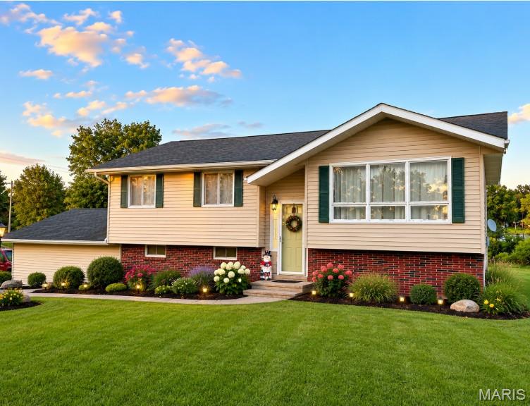 This beautifully remodeled 1-acre property on Highway 63, just north of Kirksville, features four spacious bedrooms and three full baths, perfect for families or those seeking extra room. The fresh updates, including new paint and flooring, create a modern and inviting atmosphere. A standout feature is the large lower-level bedroom and bath addition, offering privacy and convenience. Enjoy the outdoors from the back porch and deck, overlooking an oversized yard that's perfect for entertaining or relaxation. This home beautifully combines comfort and space, making it an ideal choice for anyone looking to enjoy rural living with easy access to nearby amenities. *AI landscaped photo