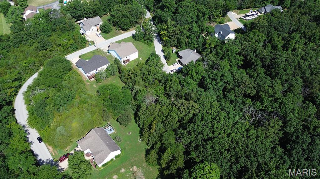 Discover an incredible opportunity with this buildable level lot located in the picturesque Raintree Plantation. This prime piece of real estate offers stunning views of the serene 53-acre Spring Lake, making it an ideal spot for your dream home or vacation retreat. This property boasts a prime location with convenient access, offering a direct route to and from one of the main gates. No winding roads or steep hills, that makes coming and going a breeze. You will have access to 4 lakes that opens up possibilities for boating, fishing, and other water activities. Take advantage of the community's amenities, which include golf course, swimming pool, and the amazing, beautiful country club. This lot is not only a blank canvas for your architectural vision but also an investment in a lifestyle that balances relaxation with recreational activities. Whether you're planning to build a primary residence or a getaway retreat, this location provides the perfect backdrop for creating lasting memories.