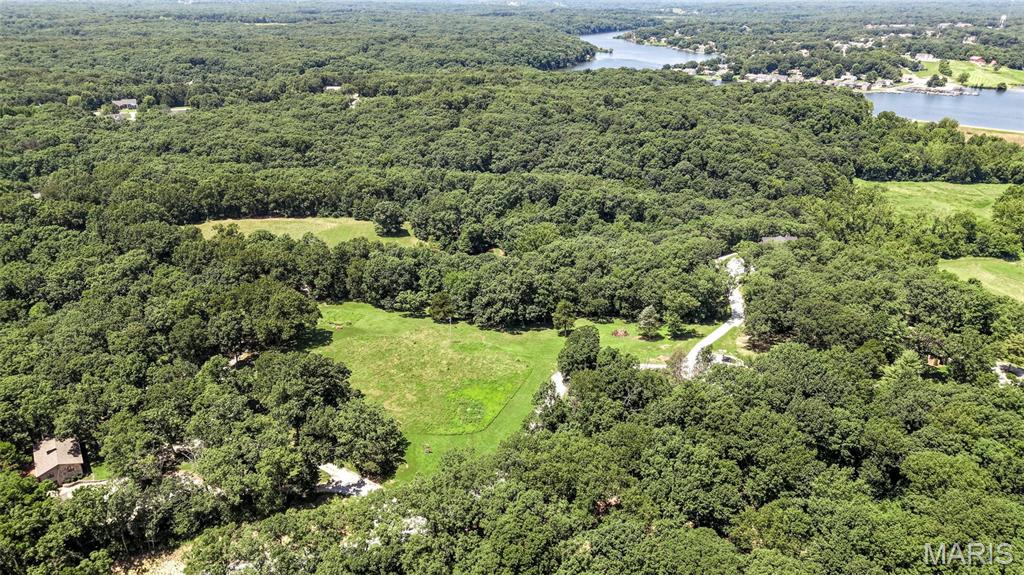Lot 4 – 5.10 Acres | Hilltop Farms
Build your dream home on this beautiful 5.00-acre homesite in Hilltop Farms, an exclusive 9-lot estate subdivision off Dietrich Road. Enjoy the privacy of a secluded setting while remaining conveniently located near shopping, dining, and top-rated Wentzville Schools.
Bring your own builder or choose from our recommended builders. Community standards help protect property values and maintain the upscale character of the subdivision, including minimum home sizes of 2,600 SF for ranch homes and 3,000 SF for 1.5-story homes, side-entry garages, 9-foot ceilings minimum, and front elevations featuring 50% or more brick or stone. All architectural plans are subject to Trustee approval.
Private well and septic systems will be required. No mobile or manufactured homes, livestock, above-ground pools, or short-term or long-term rentals are permitted. Roads within the subdivision will be paved.
Showings by appointment only as access is via a private road. Located in unincorporated St. Charles County and subject to county building and zoning requirements. Buyers are encouraged to request and review the full Indenture and Restrictive Covenants prior to submitting an offer.