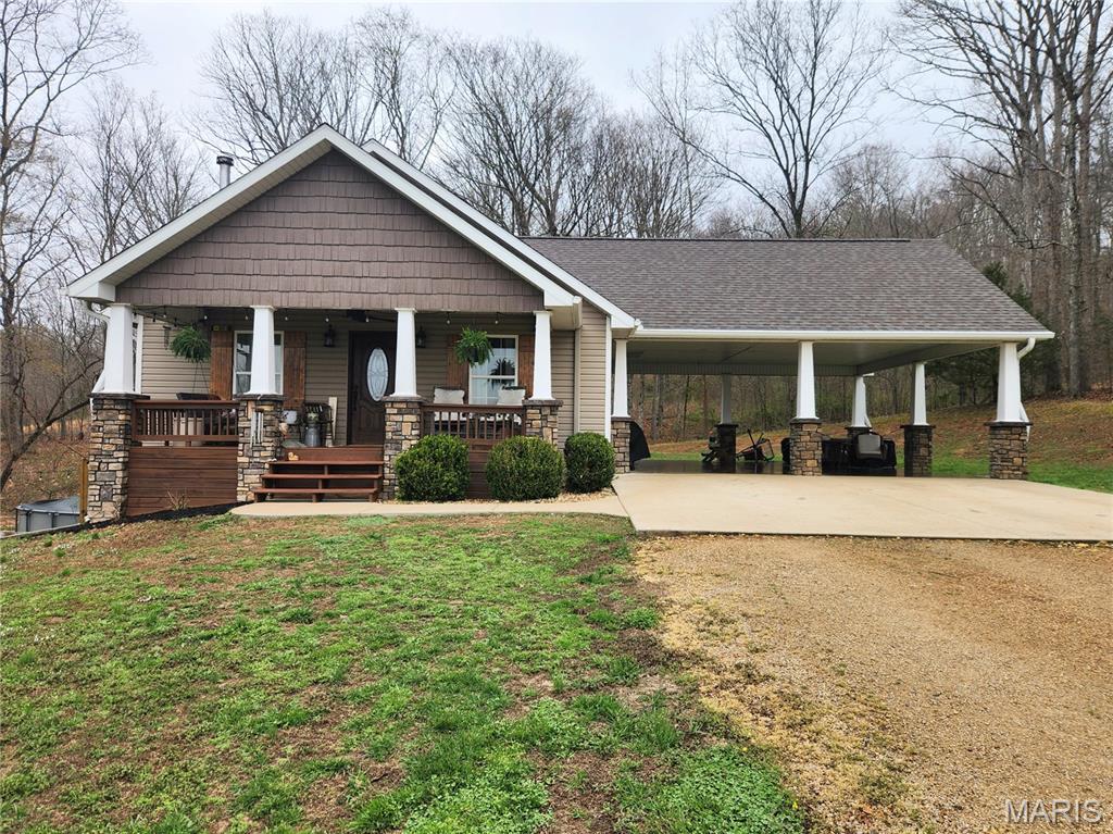 Nestled in a valley on 5 secluded acres surrounded by woods, this cozy home offers peaceful country living with wildlife often seen right in the front yard. The home features a full walkout basement, adding extra space and convenience.

The property also includes an oversized insulated shop with two exterior lean-tos, providing plenty of room for projects, equipment, or storage. An oversized carport offers versatile space for parking, gatherings, or hosting outdoor parties.

A perfect blend of privacy, nature, and functional space on this beautiful serene acreage. ????