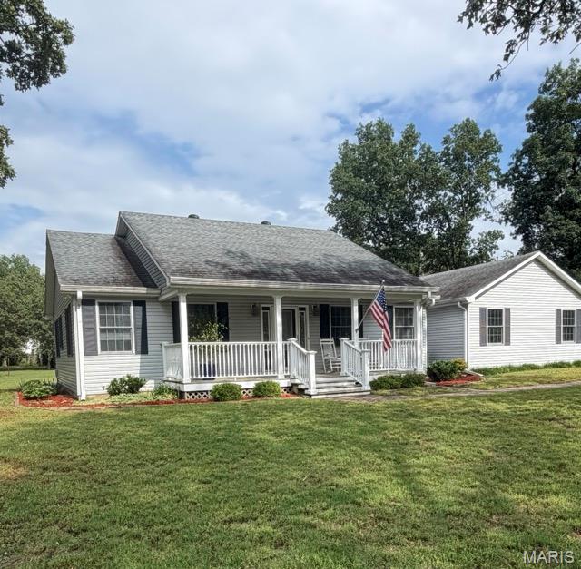 Price reduced dramatically. Motivated sellers are offering this exceptional opportunity to own a beautifully updated, energy-efficient country retreat on 4.16 acres conveniently located between Cape Girardeau and Sikeston. Meticulously maintained 3-bedroom, 2.5-bath home combines modern comfort with rural charm, featuring a fully finished dry basement w/ abundant storage and wet bar, stunning hickory hardwood and tile flooring throughout, a cozy wood-burning fireplace, and custom touches including hardwood flooring milled from trees on property. The spacious kitchen boasts new solid surface countertops, gas cooktop, and built-in electric oven. While the primary suite offers a luxurious low-entry shower and double vanities. Outside, enjoy a peaceful evening under the stars from the new deck/hot tub or gather around the fire pit. Additional highlights include: a 10k solar system for lower utility costs, 24’x48’ heated/cooled shop, two propane tanks, sound-insulated interior walls.