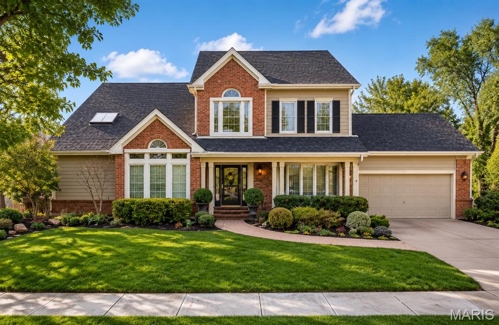 Nestled in the highly sought-after The Forest subdivision in Chesterfield, this exceptionally updated and meticulously maintained. 1.5-story brick and Hardie-sided home offers an exceptional blend of timeless architecture, thoughtful updates, and incredible living space surrounded by a serene wooded setting. From the moment you arrive, the paver driveway, attractive exterior, and mature landscaping create stunning curb appeal. Inside, the home offers a spacious and functional floor plan designed for both everyday living and entertaining. The main-floor primary suite serves as a private retreat featuring direct access to the expansive rear deck and a beautifully updated primary bath. The heart of the home features a large great room with soaring ceilings, a wet bar, and fireplace, creating an inviting gathering space filled with natural light. The main level also includes a generous formal dining room with bay window, separate living room, and an expansive eat-in kitchen with granite countertops, stainless steel appliances, and abundant cabinetry. Just off the kitchen, a charming sunroom offers the perfect place to relax while overlooking the beautiful wooded backyard. Step outside to enjoy one of the home’s standout features — a large deck spanning the width of the home, complete with a covered awning and ceiling fan, creating an exceptional outdoor entertaining space with peaceful privacy. The second floor offers three additional spacious bedrooms, two full bathrooms, and a large loft area, providing flexibility for family, guests, home office space, or additional recreation. The finished walk-out lower level expands the living space even further with a nicely appointed recreation area, small kitchenette, full bath, and abundant storage space. Additional features include attached 2-car garage, upgraded windows, durable Hardie siding, extensive storage throughout, and a premium wooded lot offering privacy and natural beauty. A rare opportunity to own a beautifully updated home in one of Chesterfield’s most desirable neighborhoods offering space, character, and exceptional indoor-outdoor living.