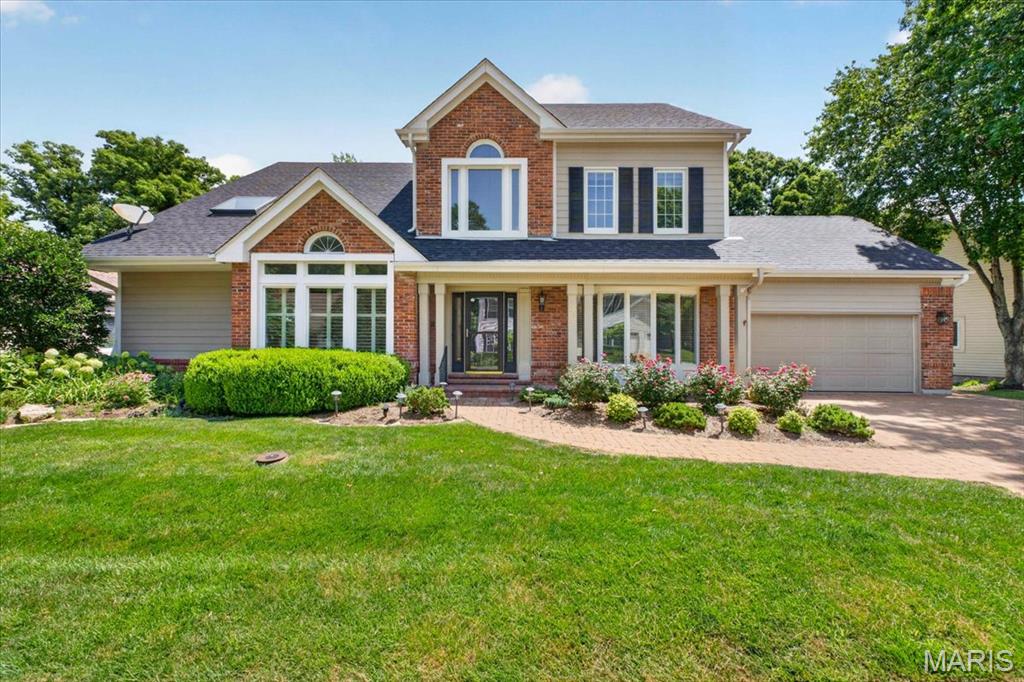 Nestled in the highly sought-after The Forest subdivision in Chesterfield, this exceptionally updated and meticulously maintained. 1.5-story brick and Hardie-sided home offers an exceptional blend of timeless architecture, thoughtful updates, and incredible living space surrounded by a serene wooded setting. From the moment you arrive, the paver driveway, attractive exterior, and mature landscaping create stunning curb appeal. Inside, the home offers a spacious and functional floor plan designed for both everyday living and entertaining. The main-floor primary suite serves as a private retreat featuring direct access to the expansive rear deck and a beautifully updated primary bath. The heart of the home features a large great room with soaring ceilings, a wet bar, and fireplace, creating an inviting gathering space filled with natural light. The main level also includes a generous formal dining room with bay window, separate living room, and an expansive eat-in kitchen with granite countertops, stainless steel appliances, and abundant cabinetry. Just off the kitchen, a charming sunroom offers the perfect place to relax while overlooking the beautiful wooded backyard. Step outside to enjoy one of the home’s standout features — a large deck spanning the width of the home, complete with a covered awning and ceiling fan, creating an exceptional outdoor entertaining space with peaceful privacy. The second floor offers three additional spacious bedrooms, two full bathrooms, and a large loft area, providing flexibility for family, guests, home office space, or additional recreation. The finished walk-out lower level expands the living space even further with a nicely appointed recreation area, small kitchenette, full bath, and abundant storage space. Additional features include attached 2-car garage, upgraded windows, durable Hardie siding, extensive storage throughout, and a premium wooded lot offering privacy and natural beauty. A rare opportunity to own a beautifully updated home in one of Chesterfield’s most desirable neighborhoods offering space, character, and exceptional indoor-outdoor living.