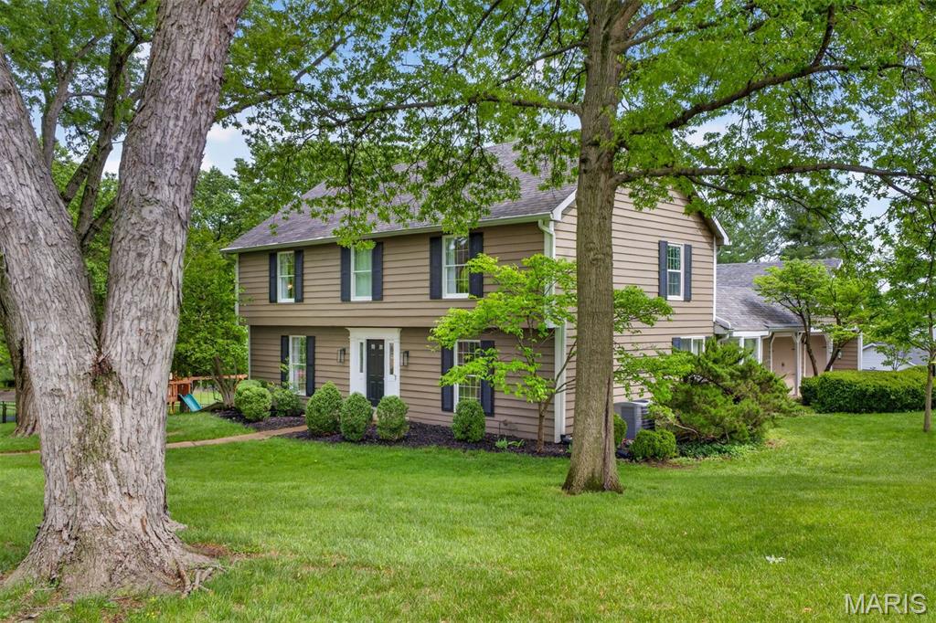 Welcome to this beautifully updated traditional home in the highly sought-after Mason Valley neighborhood of Town and Country. Thoughtfully renovated and designed for modern living, this four-bedroom, three-and-a-half-bath residence blends timeless architecture with fresh, contemporary style. A welcoming center-hall floor plan opens to expansive living spaces, enhanced by newly installed hardwood flooring throughout the main and second levels. The home's thoughtful flow continues through the formal living room and into the inviting family room, where a gas fireplace serves as a warm focal point. At the heart of the home is a light-filled, Scandinavian-inspired kitchen featuring crisp white cabinetry, upgraded finishes, and a casual dining area bathed in natural light from morning to evening. Seamlessly connected to the family room, this space invites everyday gatherings and effortless entertaining.
Just beyond, a private stone courtyard patio creates a natural extension of the living space, offering the perfect setting for morning coffee, outdoor dining, or evenings with friends. Steps lead to the fenced backyard below, providing room to relax, play, and enjoy the outdoors. The main-floor laundry room is conveniently positioned near the garage entry for everyday ease.
Upstairs, the spacious primary suite offers a private retreat with a walk-in closet and a beautifully updated bath featuring dual vanities, a large walk-in shower, and a soaking tub.
The finished lower level expands the home's versatility with a generous recreation area, new white oak luxury vinyl, a mini bar, a full bath, and sliding glass doors leading directly to the backyard. An additional unfinished area provides abundant storage, hobby space, or room for future customization.
A side-entry two-car garage includes a separate storage and workshop area, adding even more functionality.
Life in Mason Valley is about more than just the home itself. Enjoy an active neighborhood atmosphere, easy access to Queeny Park's trails, playgrounds, and events, and the convenience of nearby dining, shopping, and everyday amenities. Here, you'll find the rare combination of a peaceful residential setting with quick access to everything the St. Louis metro area has to offer.  This home was on hold solely at the seller's request due to family scheduling. It was not under contract. Come see this amazing updated home!
