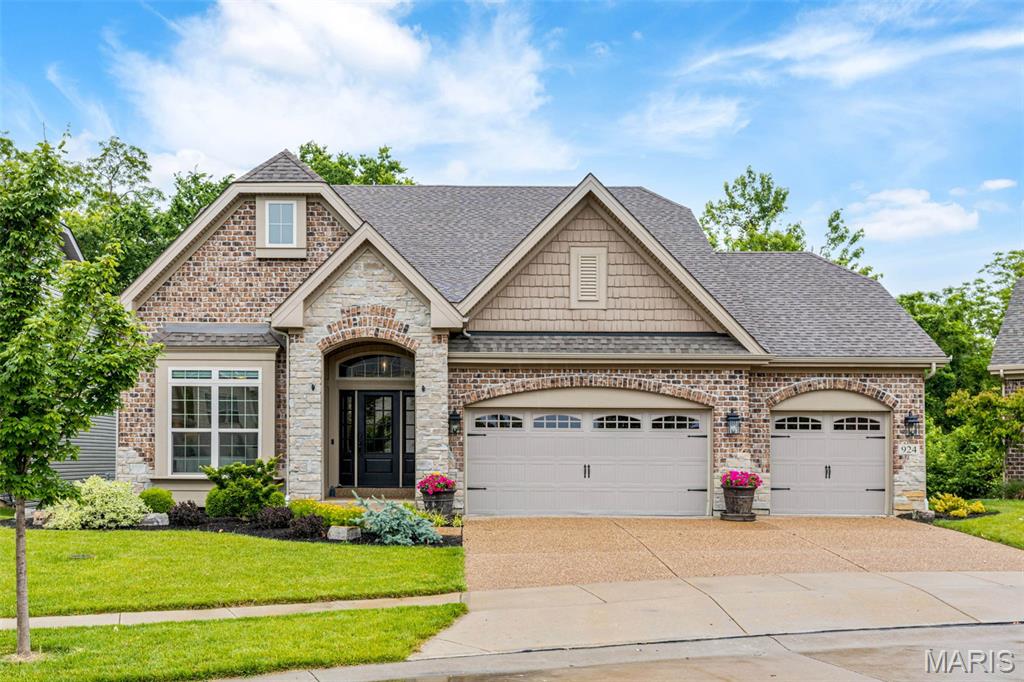 This 5-year-young luxury ranch with all the extras blends sophistication, comfort, and smart design. One of the very best lots on Grand Reserve, backing to trees for year-round privacy and wildlife viewing. Featuring 2 ensuite bedrooms (one on each level), 2 additional bedrooms, and 4 full baths, it’s ideal for flexible, modern living. The open layout flows to a full-width deck with built-in lighting, screened porch, and oversized hot tub with lights and sound system. Backing to tree-lined common ground, enjoy year-round serene wooded views, a professionally landscaped yard, and upscale finishes throughout. The kitchen boasts double ovens and a built-in coffee system with app controls, microwave drawer, walk in pantry and convenient cookpot filler at stove. The main-level primary suite offers heated floors, a digital shower, and an extra large custom walk-in closet with premium shelving and shoe storage - a must-see. Oversized newer hot tub, six mounted TVs, fridge, washer, and dryer ALL stay with the home, as well as all upgraded appliances as viewed. Other features include a desirable 3-car garage, integrated sound system inside & out, main-level laundry, and a secondary laundry hookup in the lower level. Every detail is designed for easy living and exceptional style. Be sure to check out the video!