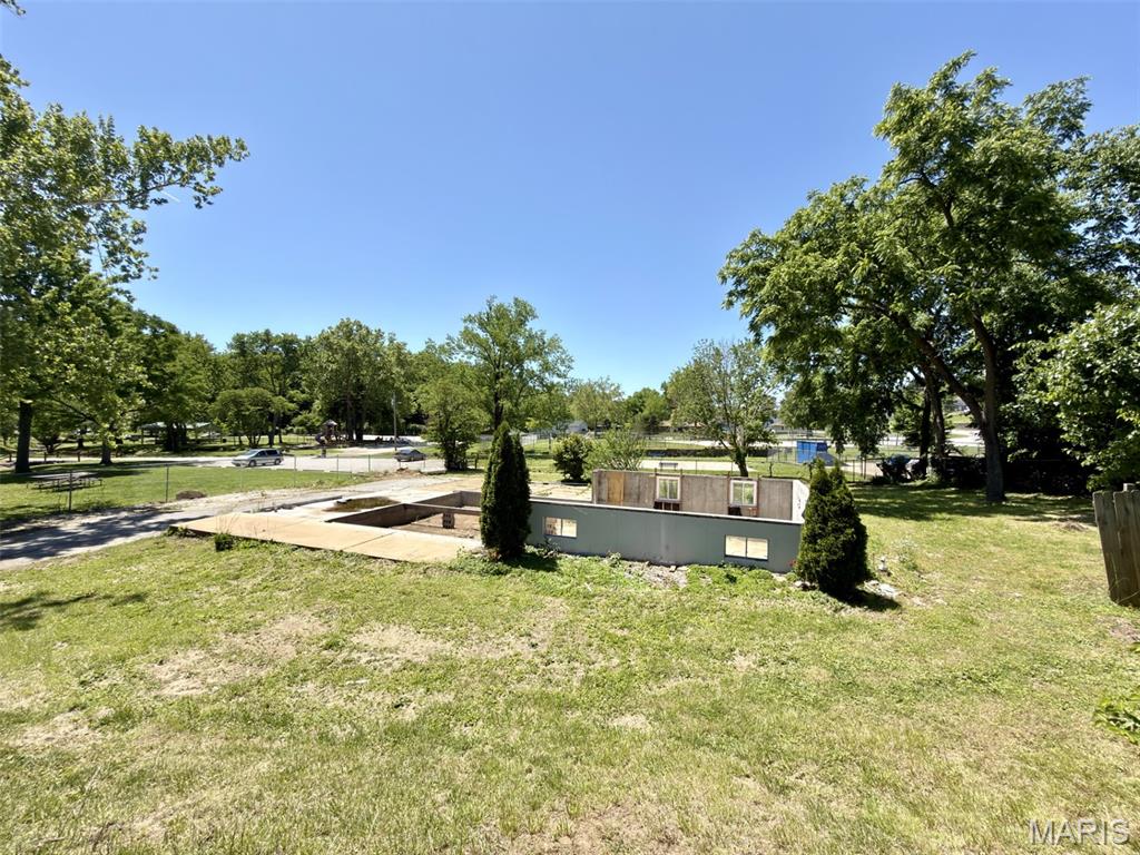 Residential lot opportunity in Arnold with existing foundation remaining from the prior home site. Per seller, the City of Arnold is expected to require removal of the remaining foundation by any future owner. Great opportunity for buyers, builders, or investors looking to explore future redevelopment possibilities in an established area near parks, shopping, schools, and major commuter routes. Property is zoned residential. An open demolition permit currently exists with the City of Arnold regarding the remaining foundation. Buyer to independently verify zoning, utility availability, permit status, demolition requirements, building requirements, lot suitability, rebuilding restrictions, and all matters related to buyer’s intended future use. A recent flood determination report is available and indicates the property is currently located in Flood Zone X (not in a Special Flood Hazard Area) according to FEMA mapping. Property sold as-is. Please exercise caution while walking the property and do not enter the fenced foundation area.