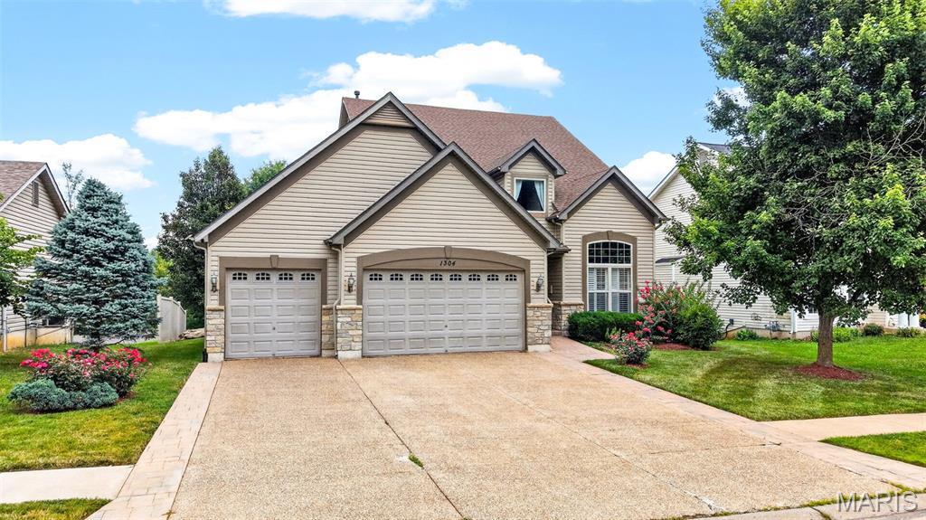 Welcome to 1304 Forest Way, where timeless elegance, thoughtful design, and exceptional living spaces come together in this beautifully maintained two-story home. Nestled on a private, tree-lined lot, this impressive residence offers over three levels of functional living designed for today's lifestyle.
A dramatic two-story foyer welcomes you into an open floor plan featuring gleaming hardwood floors, soaring ceilings, plantation shutters, elegant formal living and dining rooms, and abundant natural light throughout. The spacious great room is the heart of the home, showcasing a cozy wood-burning fireplace with custom built-in bookcases and a stunning wall of windows overlooking the peaceful backyard.
The beautifully appointed kitchen offers an abundance of cabinetry, expansive breakfast bar, pantry, stainless steel appliances, generous prep space, and an adjoining breakfast room with direct access to the oversized composite deck—perfect for entertaining or enjoying morning coffee surrounded by mature trees.
Retreat to the luxurious primary suite featuring a spacious walk-in closet and spa-inspired bath complete with dual vanities, oversized soaking tub, separate shower, and private water closet. Three additional generously sized bedrooms provide excellent closet space and share a full bath.
The finished walk-out lower level offers incredible versatility with a massive recreation room, full bath, and direct access to the covered patio and backyard. Whether used as a media room, game room, fitness area, home office, or guest retreat, this space is ready to accommodate your lifestyle.
Additional highlights include an oversized three-car garage with built-in storage cabinets, extensive hardwood flooring, abundant storage, mature landscaping, and multiple outdoor entertaining spaces that seamlessly blend indoor and outdoor living.