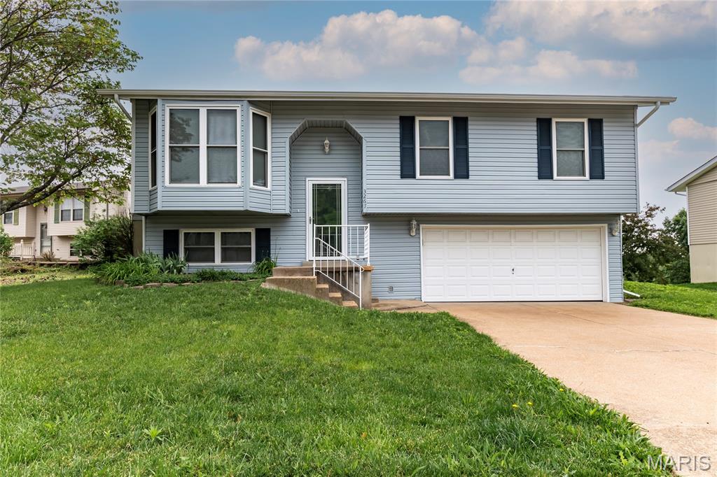 This wonderful split foyer home has so much to offer. Enjoy a large living room with updated lvp flooring and a bay window that allows so much natural light. Off the living room, is the breakfast room and kitchen. Down the hall, three newly painted bedrooms with the same lvp flooring for perfect continuity. Full bath with an updated vanity and a solar tube which is a neat addition. The lower level boasts a nice family room and recreation room with new paint, new carpet, and there is even some built in shelving. Additionally, there is another full bathroom in the LL and a laundry/utility room. The 2 car garage is oversized with shelving and even space for a workbench. Outside you can enjoy a low maintenance deck and large fenced in backyard. New roof and new siding complete the exterior. Great location in a cul-de-sac and backs to elementary school which is very convenient. Come see! Showings start May 29th.