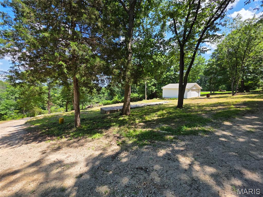 Great building lot with a view! This 1.1 acre parcel is perched on a hill and features a septic, electric and 2 car detached garage.   There is also a mobile home pad that could be used if so desired. This lot is close to Hwy 30 for quick access but still hidden and has a great view. Feel free to drive by!