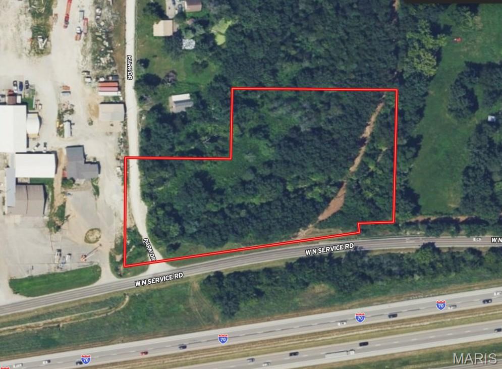 4 ACRES WITH HIGH-VISIBILITY I-70 FRONTAGE!!! Gently rolling 4-acre corner parcel located at the intersection of the North Service Road and Park Drive, featuring more than 500 feet of road frontage facing Interstate 70. Zoned C-1, this property offers exceptional flexibility for a variety of commercial or residential development opportunities. With excellent visibility, easy access, and available utilities including electric and water, this site is well-positioned for future growth and investment potential.