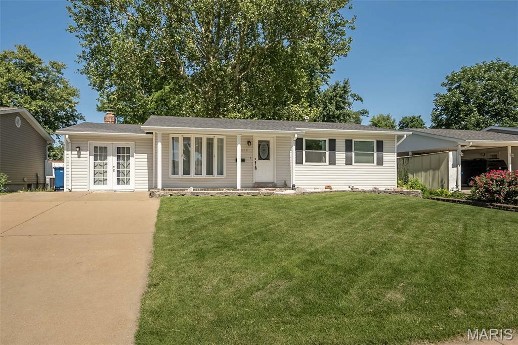 WOW!!! Fantastic curb appeal with this beautifully updated 3+Bedroom ranch. Main floor includes Large living room with hardwoods + big bay window with crank outs, Giant family room (25 x 11) w/ woodburning fireplace, new luxury vinyl flooring +sliding door to covered patio/deck, Dining room w/hardwoods that opens to kitchen & huge patio/deck, Gourmet kitchen w/ white cabinets, granite countertops, wall oven, electric cooktop, dishwasher & new luxury vinyl flooring. Primary bedroom w/hardwoods, updated half bath & door to patio/deck. 2 more spacious bedrooms w/ hardwoods plus an updated full bath finish main floor. Lower level with rec room w/ new laminate flooring & built in storage, Office/4th guest bedroom area with new laminate flooring. Large storage area with workshop & built in storage shelves. Gorgeous private level back yard w/ privacy fencing, unbelievably large patio/deck w/ covered area, storage shed. Double wide driveway for extra parking. Newer tilt in windows, six panel doors and much more. You can move right in it has already passed Maryland Heights occupancy inspection.
