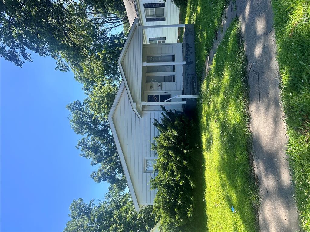 cute little bungalow,  alley access , needs some work but could be such a doll house., living room w/wood floors, kitchen, laundry room, 2-bedroom 1 bath.  Vinyl sided updated electrical large, detached garage.