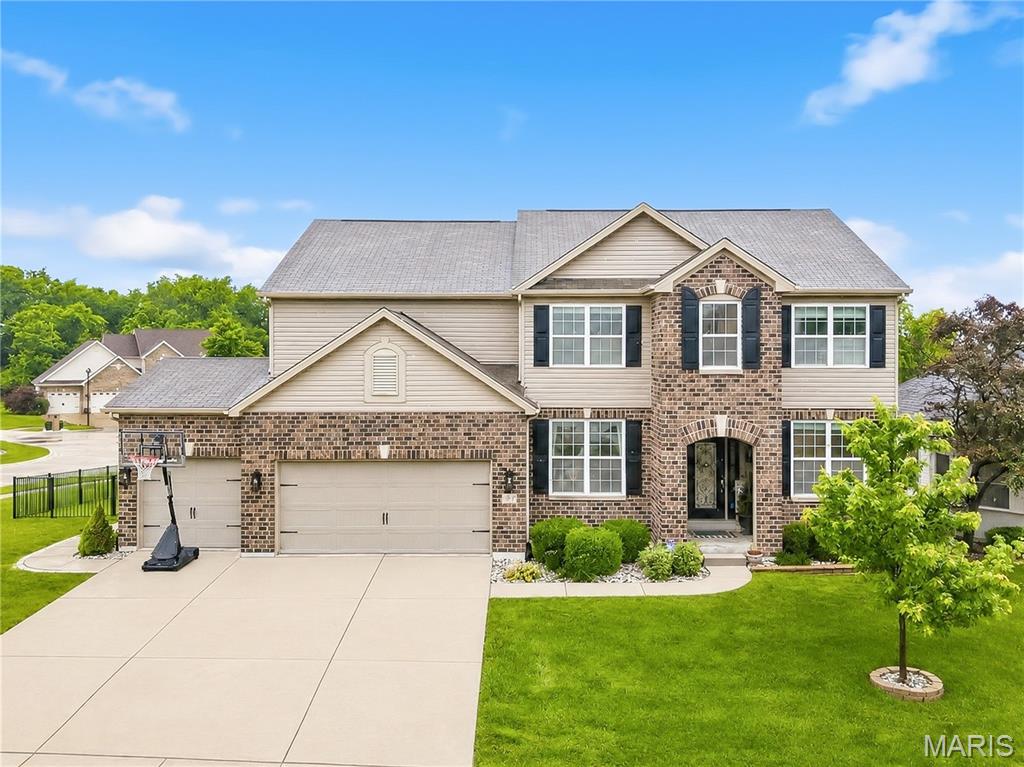 Spacious, stylish, and thoughtfully designed for real life, this rare find checks every box. Priceless upgrades include an extra-deep garage big enough for your full-size truck, three full baths upstairs, upstairs laundry, and a level 1/3 acre fenced lot that doesn’t back to another home. Every inch shows picture-perfect, with custom finishes throughout: stone accents, barn doors, updated lighting, and exceptional decor. A dramatic two-story great room is flooded with natural light and open to the main level, creating an ideal space for everyday living and entertaining. Just inside the back door, you’ll love the practical design: spacious cubbies flanked by an oversized walk-in closet—perfect for shoes, sports bags, and all those hard-to-organize essentials. The finished walkout lower level adds even more flexibility with a family room and wet bar, 5th bedroom, full bath, second laundry, and plenty of storage. Outside, the expansive, fully fenced yard offers room to play, garden, host gatherings, or simply relax in privacy. All of this in a prime location, very close to both public and private schools, and just minutes from restaurants, shopping, and entertainment. A truly perfect package for you!