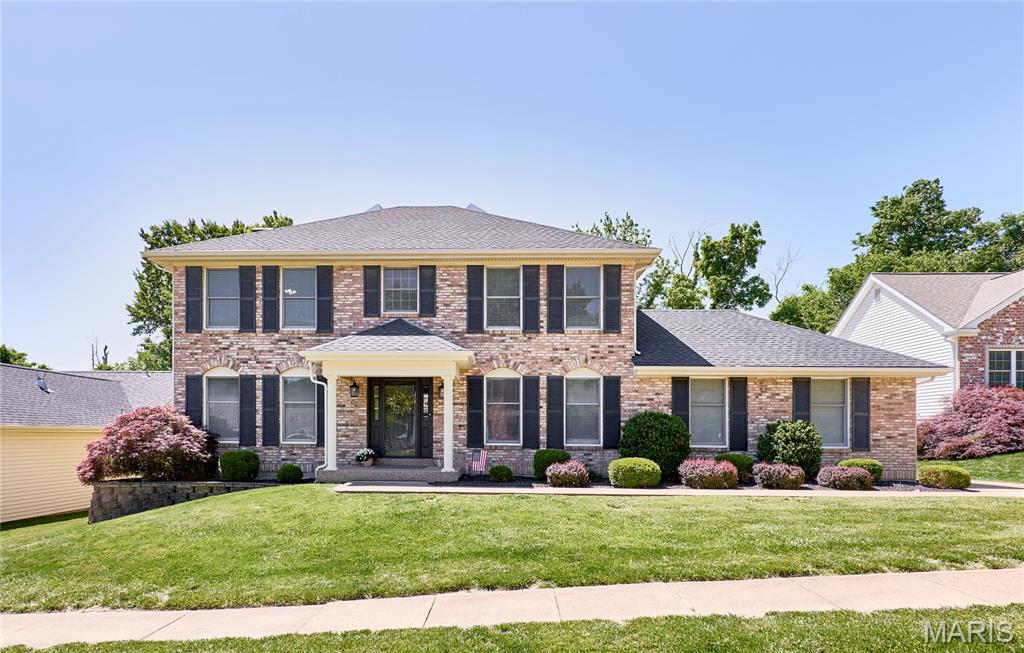 Open House is cancelled.  Stunning two story traditional brick 4 bedroom, 2 full bathrooms and 2 1/2 baths home with 2-car rear entry garage in a prime location!  Step into a light-filled, 2-story entryway featuring beautiful hardwood floors throughout the house. A versatile front room serves perfectly as a quiet home office, playroom, or traditional living area, complemented by a formal dining room with crown molding.  The heart of the home features a cozy  gas fireplace flanked by custom bookshelves and a bright bay window that flows seamlessly into a fully updated kitchen featuring 42” custom cabinetry, granite countertops, a center island/breakfast bar and stainless-steel appliances. Enjoy the three-season sunroom perfect for family gatherings or morning coffee.  Your primary suite has elegant French doors with a tray-ceiling and a walk-in closet. Double vanities, a beautiful soaking tub and separate shower complete your primary bath. 3 spacious bedrooms and a 2nd full bath provide plenty of space for family or guests. Newly renovated finished basement can be used as an entertainment room, gym  or office. Newly installed 1/2 bath and ample storage space complete your lower level. Your large level fenced backyard offers privacy and relaxation.  Roof 2024. Move-in ready!
