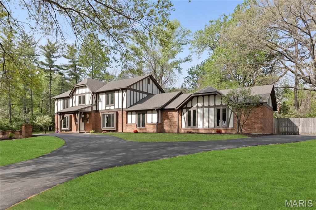 Absolutely stunning renovation on this massive home in the heart of Creve Coeur! So many updates and features throughout! Amazing curb appeal with fresh landscaping and recently resurfaced driveway on a 1 acre lot! Spacious foyer will greet you as you enter with all brand new hardwood floors flowing throughout most of the main level! Spacious formal living room with all new lighting and crown molding. Adjacent massive great room with gas fireplace, new canned lighting, and wet bar with new quartz countertops! Updated kitchen boasts all new 42" cabinets with stainless appliances, new quartz countertops, new tile backsplash, new lighting, island with bar stool seating, and lots of custom pantry space! Adjacent 4 seasons room with its own separate HVAC system and new flooring with an outstanding view overlooking the massive back yard! Main floor laundry with new tile flooring! Large formal dining room with crown molding and new fixture! All 5 main level bathrooms boast new ceramic tile, new vanities and quartz tops, new toilets, flooring, and fixtures! Upper level features a massive primary bedroom suite with coffered ceilings, full bath with all new luxurious 5x5 shower with 2 showerheads and new tiled surround, new double bowl vanity and all new flooring! Huge walk in closet! Three additional large upstairs bedrooms all with lots of closet space! TWO upstairs hall baths with new flooring, tile, vanities, and fixtures! All carpeting throughout the home is brand new! Lower level is massive and offers a large rec room with canned lighting, decorative fireplace, all new wet bar with cabinet storage, full bath with new flooring, vanity, and toilet, and additional office area. Nearly 5500 square feet of finished living space in this beautiful home! Additional features include brand new roof, all new baseboards throughout, tons of crown molding, three hvac systems, oversized three car garage, fresh landscaping, all new light and plumbing fixtures throughout, new door hinges and handles throughout, new light fixtures throughout, Anderson windows, amazing location on a culdesac street within close proximity to highway 270 and 141, schools, shopping, and so much more! Homes like this are hard to find, this one is a must see!