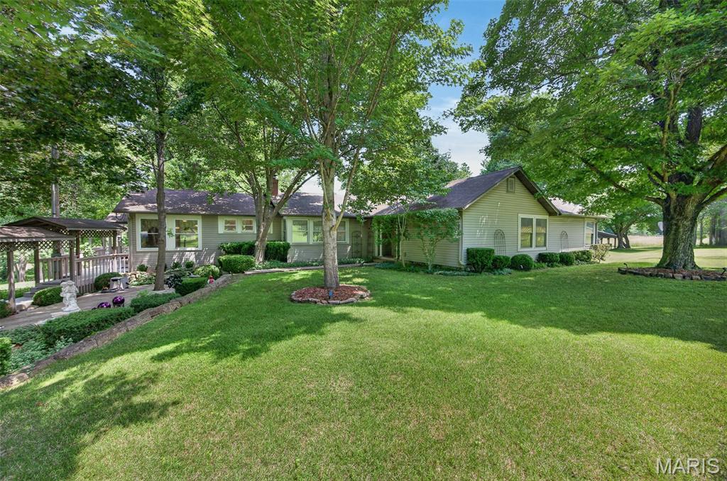 This exceptional 103-acre Gasconade River farm has been owned by the same family since its original land grant in 1853.  It features a beautifully remodeled & exceptionally maintained family home, scenic countryside, abundant wildlife, and direct river access.
The spacious residence offers 3 bedrooms, 2.5 bathrooms, a large eat-in kitchen, and a separate formal dining room. The expansive primary suite serves as a private retreat, complete with its own sitting area, fireplace, walk-in closet, and luxurious en-suite bath.  There’s also a storage/utility/storm shelter basement with walk-out door to the exterior.
Outside, you'll find a park-like setting with mature landscaping, a tranquil fountain, and multiple outdoor gathering spaces designed for entertaining family and friends. The backyard comfortably accommodates large gatherings, with seating for more than 30 guests. A former in-ground pool remains beneath the existing deck, providing the opportunity for restoration if desired.
The property is exceptionally well-equipped with a large 3+ car garage featuring workshop space and attic storage, a woodshed, and two additional outbuildings ideal for equipment, recreational vehicles, or farm use.
The land itself is truly special. Currently leased for hay production, approx. 50% is open acreage and is beautifully maintained while offering income potential. Two year-round springs, a pond, and a network of wooded trails create endless opportunities for exploration & hunting. Deer, turkey, and other native Missouri wildlife thrive throughout the property, with every trail eventually leading to the crown jewel—the Gasconade River.
Almost 1400 feet of Gasconade River frontage, you'll enjoy easy access to swimming, fishing, kayaking, floating, and gigging right from your own property.
Conveniently located along Historic Route 66, this remarkable farm offers easy access to I-44 and is approximately 20 minutes from Fort Leonard Wood, Waynesville, and 10 minutes to Lebanon—providing the perfect balance of privacy and accessibility. -Survey in progress.