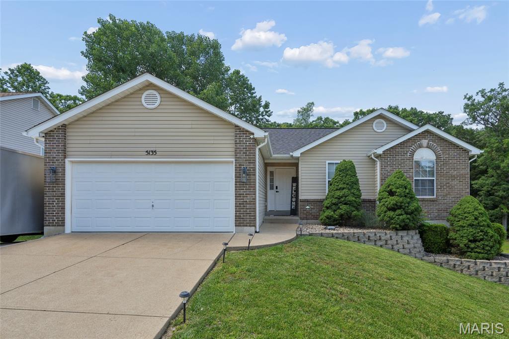This adorably updated 4-bedroom, 3-full-bath ranch with a walkout basement is in PRIME location. Situated in the heart of Hillsboro, in the sought out subdivision of Eagle Ridge it is within close proximity to the Hillsboro schools, shops, restaurants that you won't want to pass up. The main level features hickory hardwoods flowing into the primary suite, highlighted by a beautiful bay windows and a walk-in closet with custom drawers and racks. The ensuite offers shiplap detailing, a garden tub, separate shower, its own linen closet, and an upgraded white vanity with a granite countertop. The kitchen includes granite countertops and a large island, and the living room is perfect for cozy evenings with a wood-burning fireplace. Spare bathroom also features upgraded white vanity with granite countertop with shiplap detailing. Main floor laundry includes a Samsung top loader washer & dryer.
The lower level boasts an oversized family room with shiplap and an electric fireplace, barn doors lead to a finished flex room or 4th bedroom with closets, a full bath with a linen closet, plus a huge storage/workshop area. You’ll love sipping morning coffee on the composite deck while taking in nature. The backyard is enclosed with privacy vinyl fencing with a gate on each side of the house. Additional driveway/parking concrete pad beside the house for extra parking. Abundant closets and storage throughout! You won’t be disappointed viewing this one. You will be ready to make it your own. Open houses canceled we are under contract