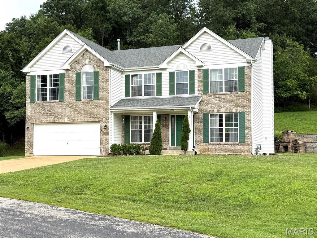 Stunning 4-Bedroom Golf Course Home at 4943 Country Club Drive, High Ridge, MO 63049.  Welcome home to this meticulously maintained 2-story gem, perfectly positioned along the 16th fairway of Sugar Creek Golf Course in desirable High Ridge!  Built in 2003, this spacious 2,912 sq ft residence sits on a generous 0.92-acre lot and offers the perfect blend of elegance, comfort, and outdoor lifestyle.   Step inside to an inviting open-concept main level featuring hardwood floors that flow seamlessly throughout.  The formal dining area is ideal for hosting gatherings, while a front office provides a convenient spot for getting work done.  The heart of the home is the expansive family room, highlighted by a cozy brick wood-burning fireplace and large window views of the landscaped yard.  The upgraded kitchen features granite countertops, 42" cabinetry, a large center island with seating, and stainless steel appliances.  Upstairs, discover a massive loft area ideal for hobbies, a playroom, or second family room retreat. The enormous primary suite boasts incredible closet space and a luxurious private bath. Three additional generously sized bedrooms, each with walk-in closets, provide ample room for family or guests.  Outside, the expansive .92-acre yard backs to a peaceful tree line, creating a private oasis perfect for unwinding after a round of golf or enjoying Missouri evenings. Located in a golf-centric community near Fenton, this property provides easy access to West County, South County, shopping, dining, and top amenities.  Sugar Creek Golf Course offers scenic rolling hills, a public course with strong local reputation, and a welcoming atmosphere for enthusiasts.  Showings begin 7/11.  Open House 7/11, 1-3pm.