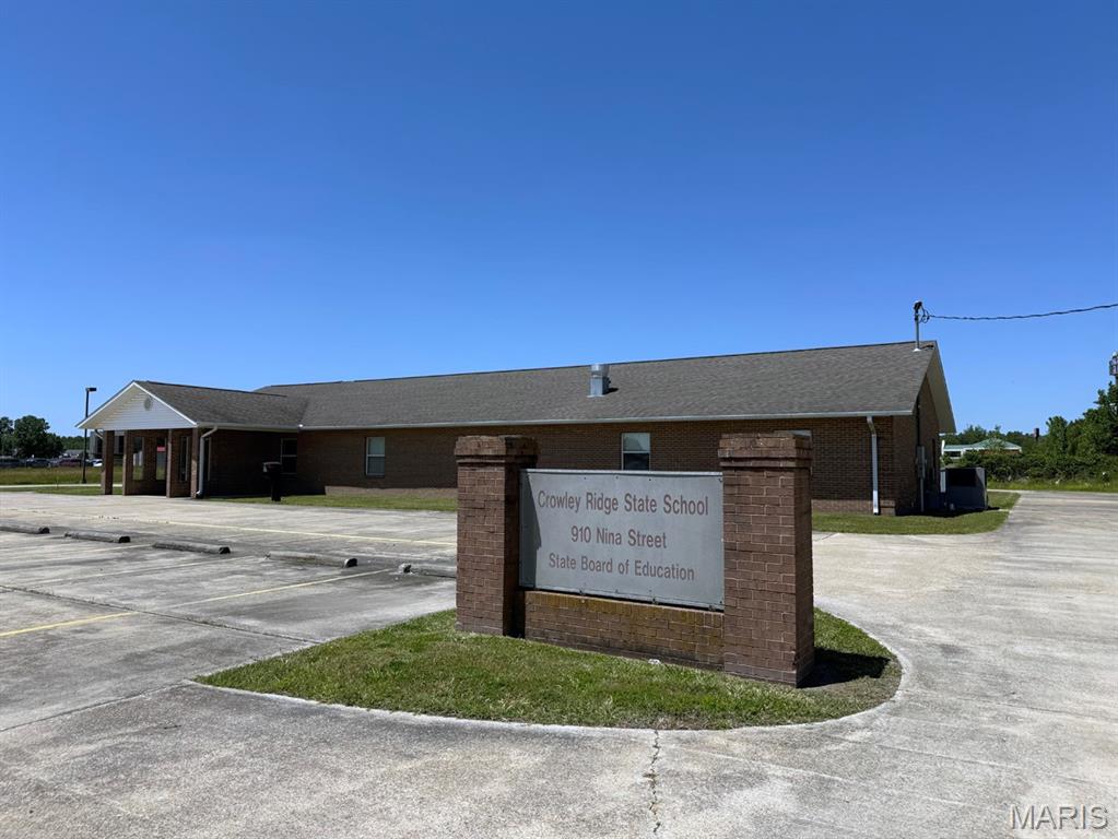 Property Highlights
• Approx. 1.41 acres 
• All-brick, single-story construction 
• Former state school facility 
• Fully ADA accessible 
• Handicap parking, entrance, and restrooms 
• Large lighted parking lot 
• High-visibility commercial district location 
• On-site signage 
• Multiple classrooms, offices, and meeting rooms 
• Commercial kitchen 
• Single-phase 400-amp electrical service 
• Fenced handicap-accessible playground 
• Suitable for educational, medical, office, daycare, or community use