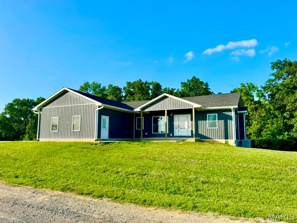 Just outside of Hannibal, but peaceful and secluded country setting? Check! Welcome to the 4,300+sqft, 5-bedroom home sitting on over 2 acres that will wow you in every category including the price point! Built in 2022, this cozy & peaceful homestead conveys a full finished basement, massive, attached garage with oversized doors, acreage, two-story deck off the back, and a priceless view of every sunset until the end of time. The primary bedroom boasts an impressive private bathroom ensuite complete with a whirlpool tub and separate walk-in shower; meanwhile the additional other 4 bedrooms are spacious and none of which all bunched in the same area of the home! Try building a home of this size, located in the perfect country setting, and anywhere near this price point...won't happen! Instead, here is your shot to take ownership of this property & make it yours before you could even break ground!