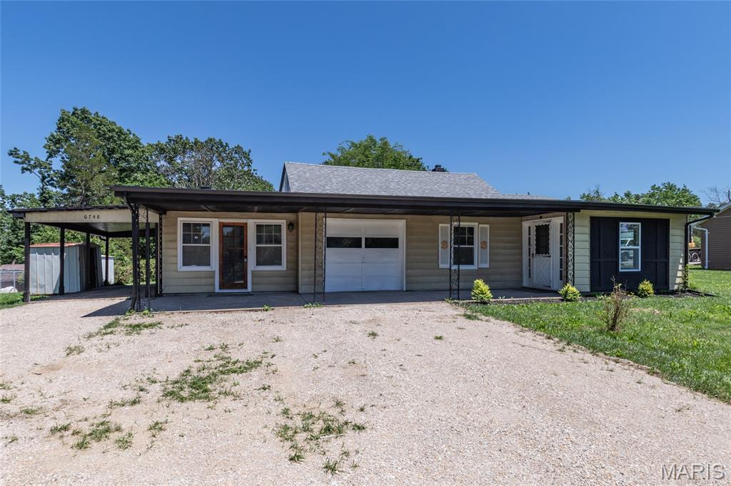 Beautifully updated 2,000 sq. ft. ranch offering modern upgrades and spacious living throughout! This move-in ready home features a completely remodeled kitchen with all-new cabinetry, stainless steel appliances, butcher block counters and stylish finishes perfect for everyday living and entertaining. Enjoy fresh flooring and paint throughout the entire home, creating a clean and contemporary feel. Major updates include a new hot water heater, partially replaced roof, upgraded aerator control box and alarm box for septic system, new gutters, and soffit for added peace of mind. also includes 1 car garage and 1 car carport. With generous living space and numerous improvements already completed, this property combines comfort, functionality, and value in one exceptional package.  Apprasiled at $215,000 and all inspctions have been done and repairs have been made.
