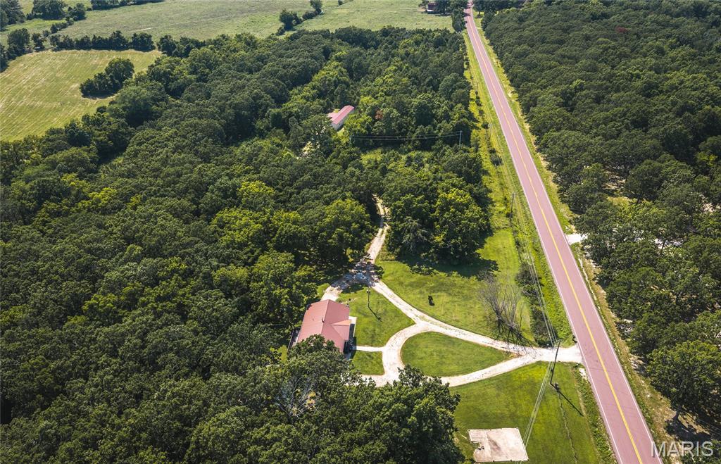 Escape to the peace and beauty of the Missouri countryside with this exceptional property featuring 27.90 picturesque acres, two residences, and endless possibilities. Conveniently located just 30 minutes from both Osage Beach and Fort Leonard Wood, this unique property offers the perfect balance of rural tranquility and everyday convenience.

The charming main home features 3 bedrooms and 2 bathrooms, providing a warm and welcoming atmosphere with plenty of space to relax and unwind. A partially finished basement expands your living options and includes additional storage along with a dedicated workshop area, making it ideal for hobbies, projects, or extra workspace. Whether you're looking for room to entertain, create, or simply spread out, this home offers the flexibility to fit your lifestyle.

Adding even more value is the 2017 manufactured home, offering 3 bedrooms, 2 bathrooms, and 1,216 square feet of comfortable living space. Perfect for multi-generational living, guests, rental income, or a caretaker's residence, this second home opens the door to countless opportunities.

The nearly 28 acres provide the privacy and freedom you've been dreaming of, with plenty of room for gardening, livestock, recreation, or simply enjoying the scenic views and abundant wildlife. Whether you're looking to establish a family homestead, invest in a property with income potential, or enjoy a peaceful country retreat, this one-of-a-kind offering is ready to make your vision a reality.

Properties with acreage, two homes, and such a convenient location are hard to find. Schedule your private showing today and experience everything this incredible countryside property has to offer!