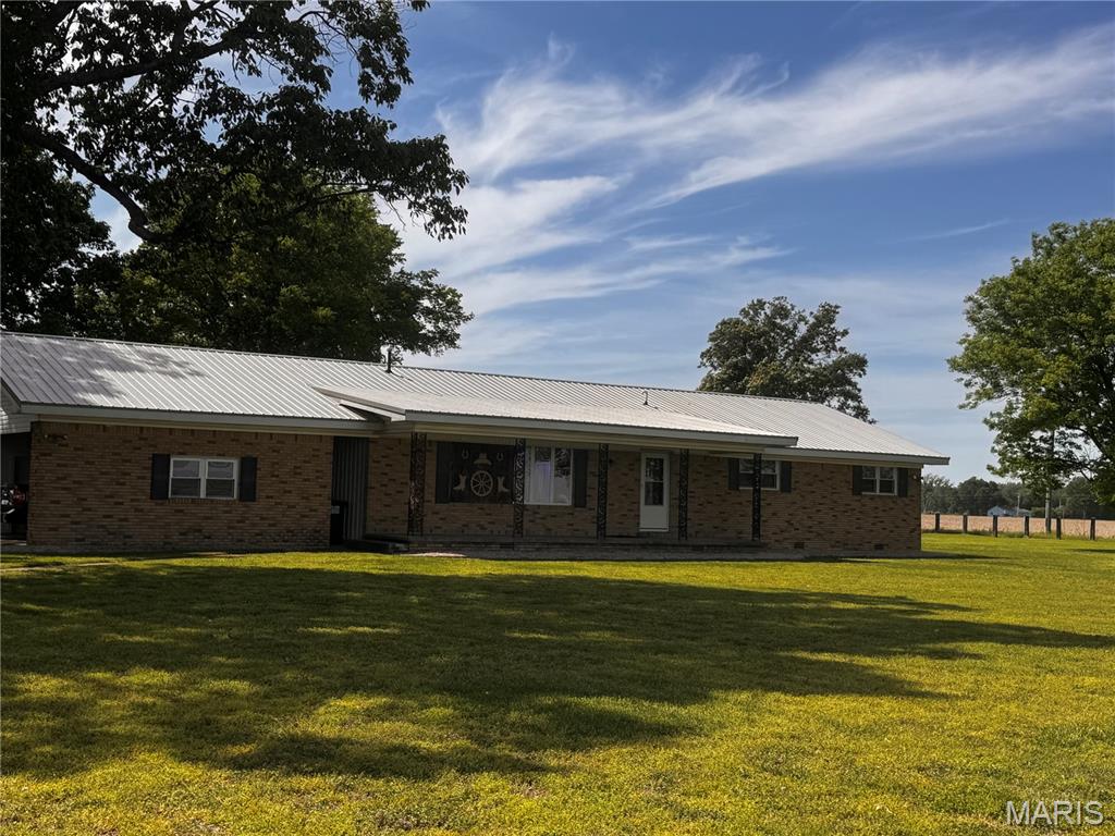 Have you been looking for a country property with room to roam?  This is it! This thoughtfully updated brick home features a metal roof, a gas log fireplace, and nice sized bedrooms with plenty of storage throughout.  Outside you will find a barn, a chicken coop and a pasture.  The 2 car carport area also has 2 storage rooms to keep your mower & tools handy.  This one is a must see, schedule your showing today.