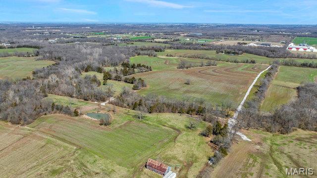 Developers welcome!  182+- acres that would make beautiful homesite(s) or development acreage tucked in Eastern Warren County, just minutes South of Interstate 70. Conveniently located between Columbia and St. Louis, MO. 92 acres of tillable land.  Walking distance to popular winery venue Cedar Lake Cellars and nearby Innsbrook Golf Resort, Big Joel's Safari, shopping, dining and more.  Located in Warren County with lower real estate taxes but on the St. Charles County line.  Some tillable land, some open, some trees, plenty of options for your needs with privacy surrounding you.  Potential infrastructure growth for highways nearby.  All but 40 acres of this is opportunity is already platted in Warren County in 3+ acres.  Access from Schreckengast Road & Old Hickory Grove Road. Minimal deed restrictions will apply.  This sale includes several TAX ID numbers.