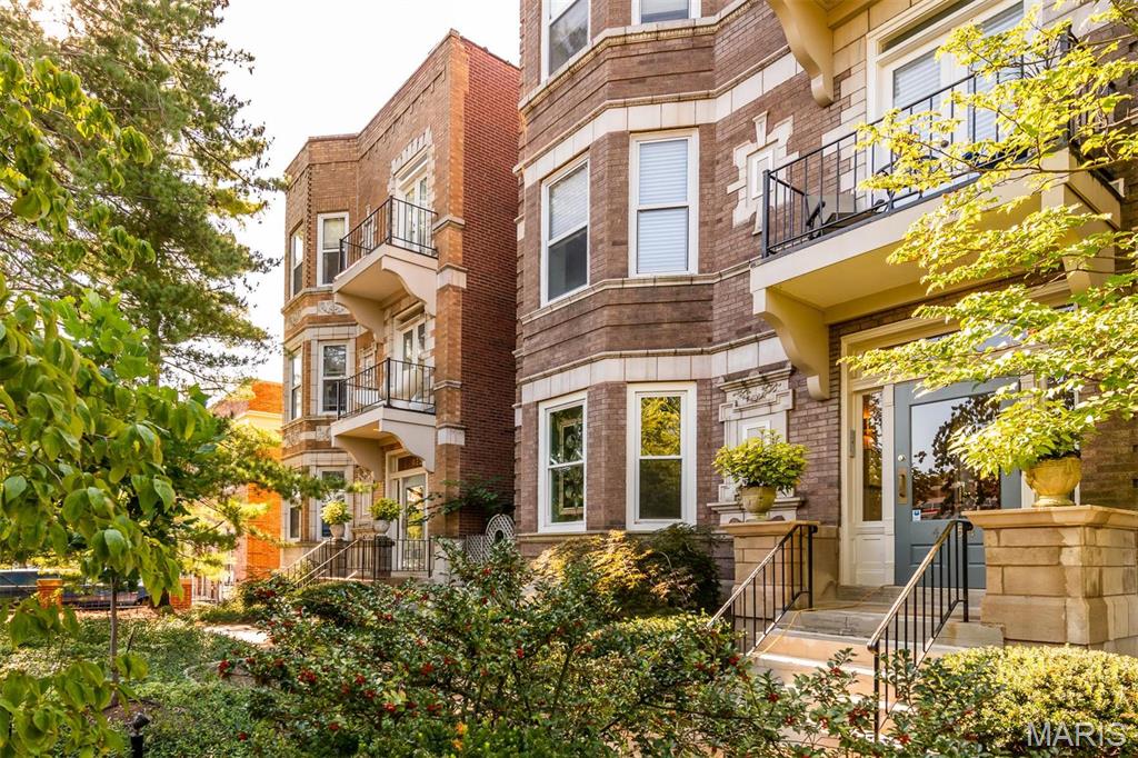 Within walking distance of restaurants, the cathedral & Cortex in the Central West End!  This spacious, updated 2bed/2bath condo provides history, charm & modern style. The kitchen has been opened up to show off the new white shaker cabinets, granite countertops & new SS appliances. The floor plan highlights the wide-plank, Barn wood style flooring & gives access from the kitchen into the light & bright Living Room that is complete w/ wood burning fire place. You’ll enjoy the bonus of two large master suites both w/ walk in closets & NEW full baths. Custom built in book case and charming office space has been added. One GARAGE space included in the secure lot, which is rare for this area.  Large laundry room w/ washer & dryer hook up.  Enjoy summer nights w/ two separate outdoor deck areas to grill or read.  Don’t miss this rare opportunity to own a updated home that has so much original charm!