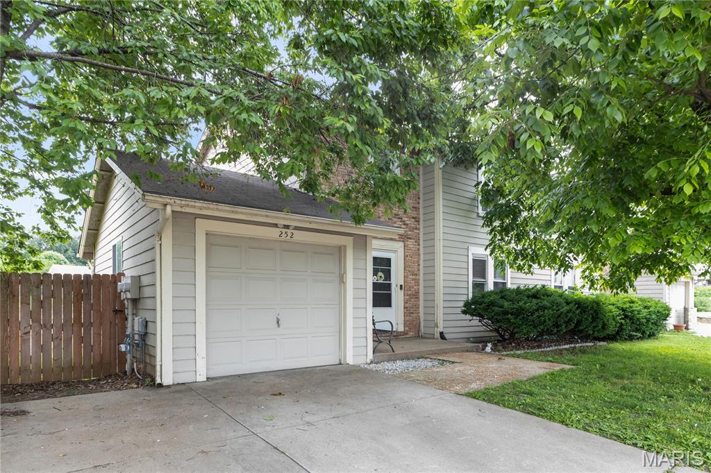 Located in the heart of St. Peters, this charming 2-story duplex offers comfortable living with 2 bedrooms, 2.5 bathrooms, and a functional open layout. The inviting family room features a cozy woodburning fireplace, perfect for relaxing evenings at home. The kitchen includes stainless steel appliances featuring a gas range, dishwasher, and refrigerator, along with a sliding glass door leading to the deck overlooking the level backyard with privacy fence — ideal for entertaining or enjoying outdoor space.

Upstairs, the spacious primary suite offers carpet flooring, ceiling fan, large walk-in closet with newer flooring, and a private bath with tub/shower combo. The second bedroom also includes carpet, ceiling fan, and its own en suite bathroom with tub/shower combo, providing comfort and privacy for guests or family members. Additional highlights include a main floor half bath, 1-car garage, newer A/C, and HVAC system updated in 2021. Conveniently located near shopping, dining, parks, and major highways, this home combines low-maintenance living with an excellent location.