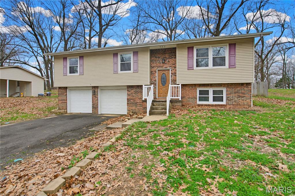 Welcome to this charming 4-bedroom, 2-bath split-level home offering comfort, space, and functionality for everyday living. The open kitchen provides plenty of room for cooking and gathering, seamlessly connecting to the main living areas. Downstairs, you'll find a cozy living room featuring a beautiful fireplace—perfect for relaxing evenings or entertaining guests. The home sits on a nicely sized lot with a fully fenced backyard, providing privacy and plenty of space for outdoor activities, pets, or gardening. With multiple levels of living space and a layout designed for both comfort and convenience, this home is ideal for families or anyone looking for room to spread out. Don't miss the opportunity to make this inviting property your next home!  Seller Financing Available Too!
