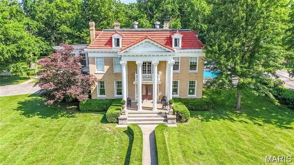 Step into timeless charm at The Stallcup House, a historic estate built in 1909. Situated on a prominent corner lot and zoned for both residential and commercial use, this distinctive property offers exceptional flexibility for a residence, event venue, office, or investment opportunity. Spanning more than 5,000 square feet, the home features 4 spacious bedrooms and showcases remarkable craftsmanship throughout. Original handcrafted woodwork, rich hardwood floors, ornate moldings, and antique chandeliers reflect the character and elegance of a bygone era. Outside, a private fenced pool and charming cabana create an inviting setting for relaxation and entertaining. Rarely does an opportunity arise to own such a notable piece of Sikeston history with the versatility to suit a variety of future uses.