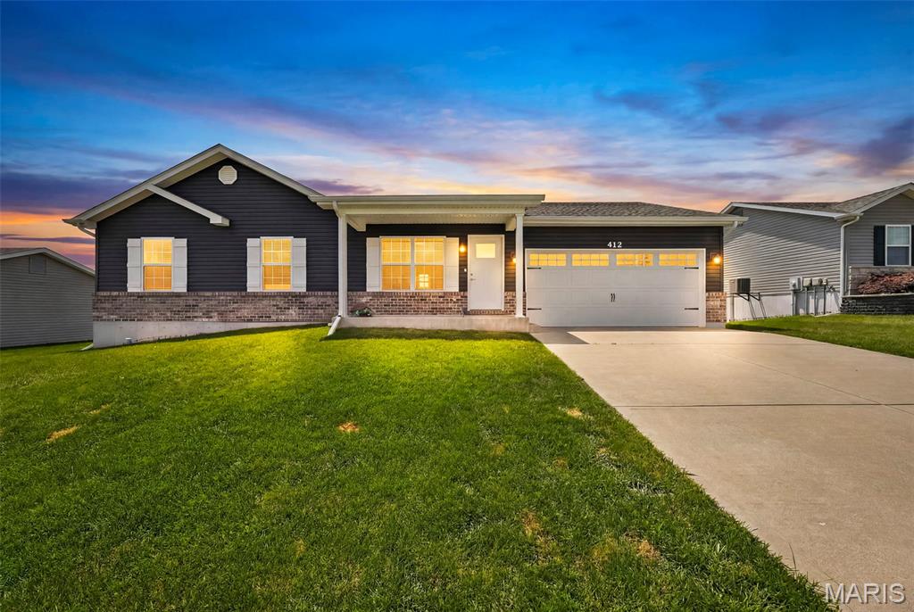 Charming, Well-Maintainted Ranch in a Quiet Neighborhood! Welcome home to this beautifully maintained 1,265 sq ft ranch offering 3 bedrooms, 2 full bathrooms, an oversized 2-car garage and the convenience of main-floor laundry. This move-in-ready home features a functional, open layout with comfortable living spaces and pride of ownership throughout. The spacious living room is flooded with natural light and a vaulted ceiling with ceiling fan. The spacious kitchen is a standout, featuring a center island, recessed lighting, abundant cabinet space, and stainless steel appliances, making it perfect for cooking, entertaining, or gathering with family and friends. All three bedrooms are conveniently located on the main level, providing easy, one-level living. The primary suite features a walk in closet, vaulted ceiling and its own private full bathroom creating a comfortable retreat at the end of the day. Each bedroom is equipped with a ceiling fan for added comfort and energy efficiency. The full unfinished basement provides endless possibilities for future living space and already includes a bathroom rough-in and an egress window, making it ideal for adding a family room, additional bedroom, or home office! Located in a peaceful, established neighborhood, you'll enjoy the perfect balance of tranquility and convenience, with easy access to Interstate 70 just minutes away for community, shopping and dining. Whether you're a first-time buyer, downsizing, or looking for a home with room to grow, this property is ready to make your own. Don't miss this wonderful opportunity!