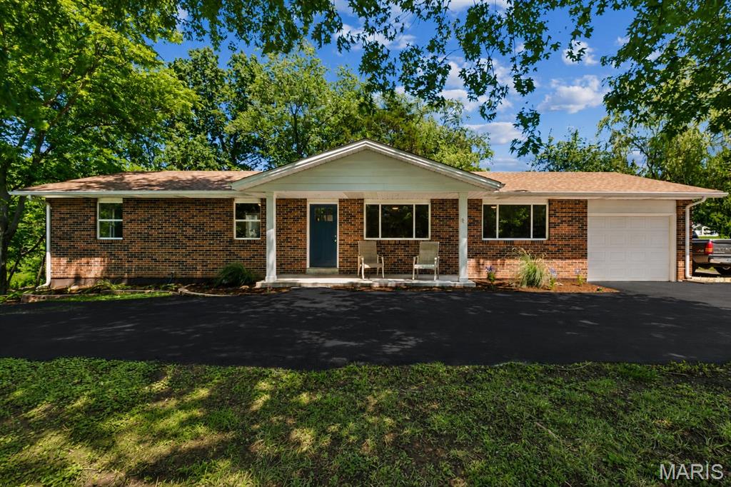 Searching for your own slice of paradise without spending half the day in the car? Well, look no further than this magical 6+ acre wooded estate in unincorporated St. Charles County, just minutes from the quaint community of Flint Hill!  Opportunity knocks on this large parcel to create whatever your heart desires~ think hobby farm, home-based business or subdivide into two three-acre lots and build your dream home - of course, with approval from St. Charles County Planning & Zoning. There's plenty of open space, mature trees and wooded privacy farther back on the lot.  

You will be romanced by the natural beauty of this unique setting from sunrise to sunset! Imagine peaceful nights under the stars or gathered round the bonfire, strolling through your own enchanted forest, planting your summer vegetable garden, or just chilling with a book on one of two patios out back! The natural landscape will take your breath away as you experience all four seasons in this thoughtfully renovated ranch home! 

Overjoyed with happiness in the details~ sun-filled windows offer stunning views of nature, and concrete-topped shaker cabinetry plus a built-in banquette, keeps guests connected with room to sip & chat in the adjoining open kitchen! Three roomy bedrooms with a primary bedroom suite, two beautifully renovated bathrooms, a den or media room, and a spacious laundry/mud room complete the main level!  
The walk-out lower level features a gardener's half bath and offers the opportunity to double your living space by designing whatever fits your lifestyle~ additional bedrooms, home theatre and gym, in-law quarters, etc.  Two-car tandem garage, 12' x 12' shed wth room to add additional garage and outbuildings. 

Enjoy rural living with easy access to highways, shopping, and services.  This is a savvy investment in a growing area! Whether you are planning for the future or ready to build your dream home, opportunities like this are rare!