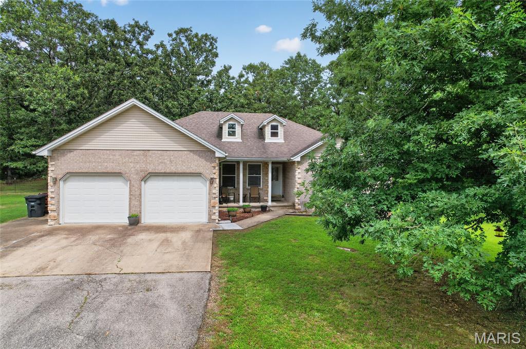 Perfectly situated on 3 picturesque, park-like acres just outside city limits, this spacious 4-bedroom, 2-bathroom home offers the rare combination of peaceful country living and a highly sought-after location. Offering the perfect balance of privacy and convenience, this property provides the peaceful country feel while remaining just minutes from local amenities. Inside, you'll find a warm and inviting layout featuring both a formal dining room for hosting family gatherings and a cozy breakfast nook for everyday meals. The thoughtfully designed floor plan offers plenty of space while still maintaining a comfortable, homey atmosphere. The garage is equipped with a mini-split system, making it ideal for a workshop, hobby space, or even a home gym. The expansive attic provides abundant storage and offers exciting potential. Gather around the inviting fire pit on cool evenings, roast marshmallows with family and friends, or simply relax while taking in the peaceful, park-like setting surrounded by mature trees. With a little TLC, this property has all the ingredients to become the forever home you've been dreaming of. Combining space, character, and an unbeatable location, this is an opportunity you won't want to miss.