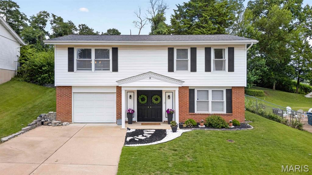 This adorable Maryland Heights home has been lovingly maintained and is ready for its next owner! Step inside to a bright, light-filled lower level offering flexible living space—perfect for a family room, home office, playroom, or, as it's currently used, a home gym.

Upstairs, you'll find the main living area, an inviting kitchen, and access to the oversized deck overlooking the spacious backyard. The kitchen features stainless steel appliances, a large pantry, a cozy eat-in dining area, and beautiful backyard views.

The upper level also includes three bedrooms and an updated full bathroom. Enjoy your morning coffee or unwind with an evening sunset from the primary bedroom's private access to the deck. The third bedroom is currently configured as a dressing room with a closet system, which can easily be removed to restore it as a traditional bedroom.

With its versatile layout, generous outdoor space, and thoughtful updates, this charming home is one you won't want to miss. Schedule your showing today!