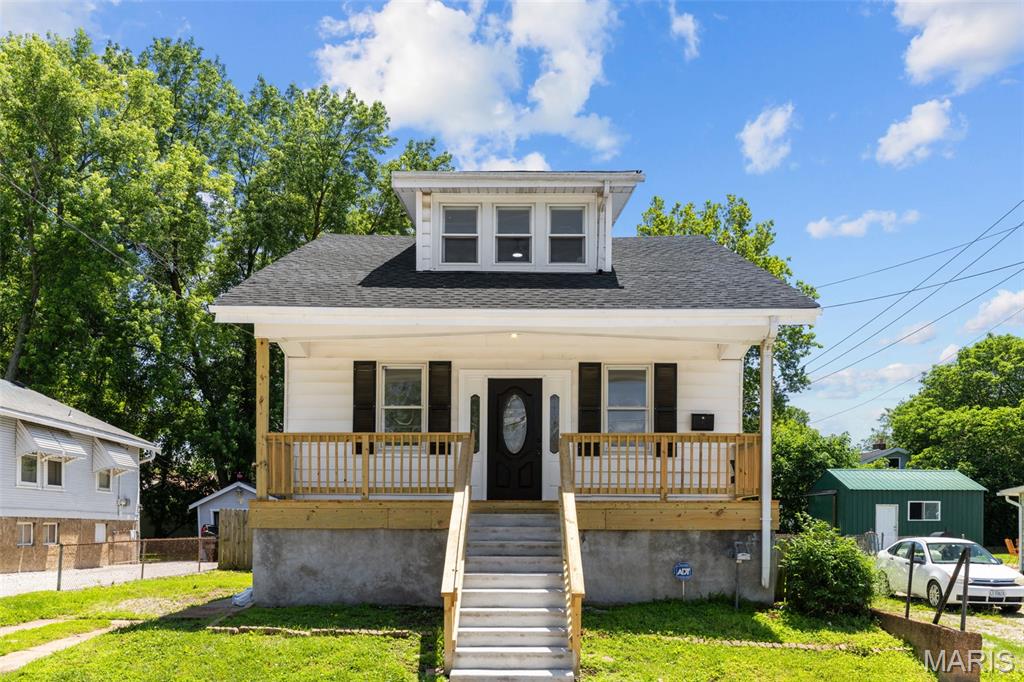Look no further than this renovated home in Lemay, just moments from Hancock Place Schools and Jefferson Barracks Park. You'll have great curb appeal with a new covered front porch and leaded-glass door leading you inside. The spacious living room features luxury vinyl plank flooring, millwork, and plenty of natural light. Beyond, the kitchen is open to the dining room, with granite counters, 42" white cabinets, a subway tile backsplash, stylish lighting, and tile floors that continue into the large laundry/mud room. A half bath with wainscoting, black fixtures and a new vanity completes the main floor. Upstairs are three spacious bedrooms, including a primary with dual walk-in closets, plus a full bathroom with a tile-surround tub. The clean and freshly painted basement has a cellar door walk-up, two finished rooms, and space for storage. Enjoy summer grilling with friends in the large fenced backyard. A new AC and roof give peace of mind. Don't miss out on this great opportunity!